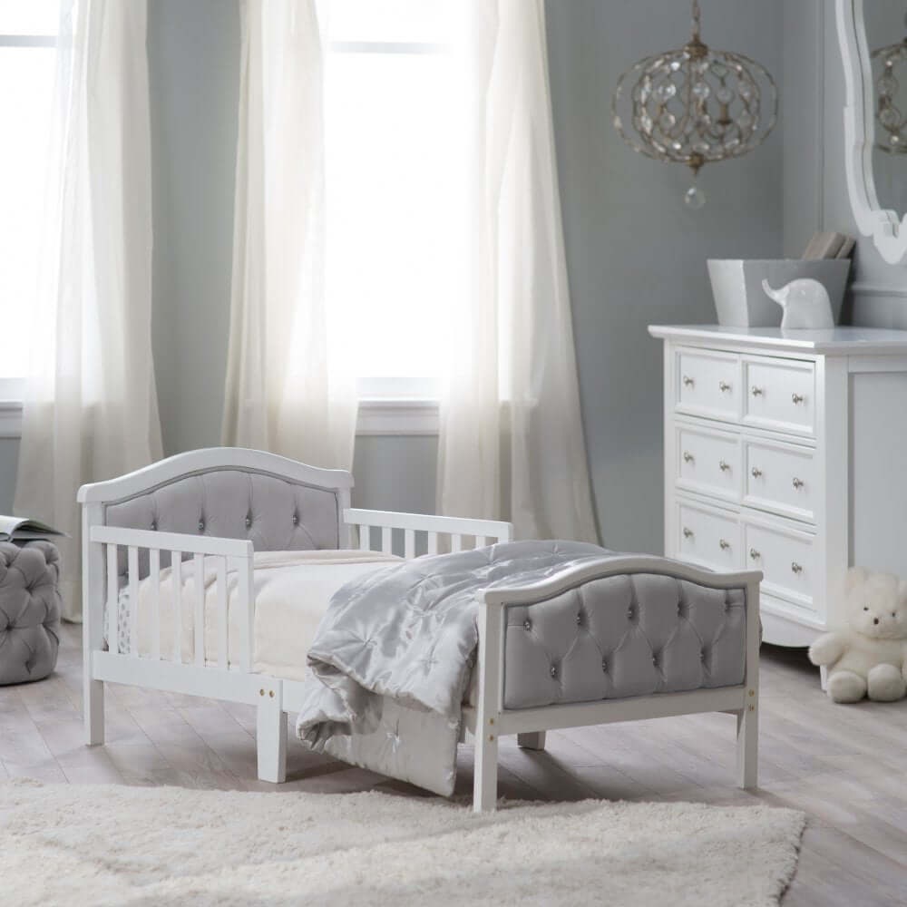 French White Padded Gray Toddler Bed - Lifestyle Image Inclined Side View French White Padded Gray Toddler Bed