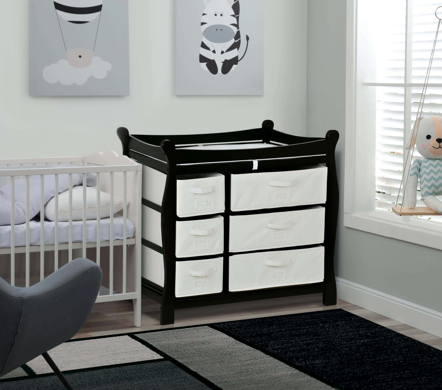 Sleigh Style Baby Changing Table with 6 Baskets -Lifestyle Image Inclined Side View of Sleigh Style Baby Changing Table with 6 Baskets Black