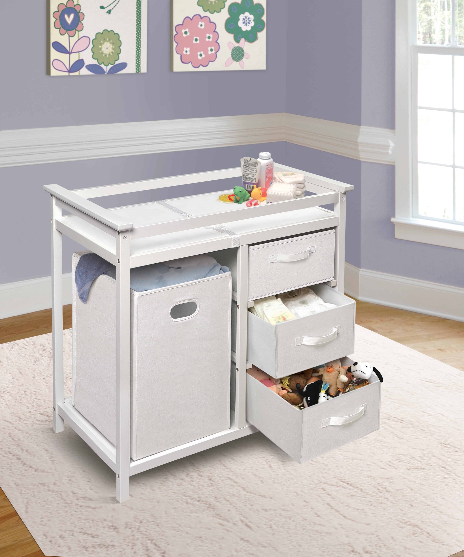 Modern Baby Changing Table with Hamper and 3 Baskets - Lifestyle Image Inclined Side View of Open Drawer Modern Baby Changing Table with Hamper and 3 Baskets White