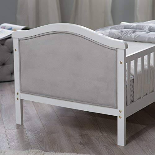French White Padded Gray Toddler Bed - Zoomed Inclined Side View of French White Padded Gray Toddler Bed
