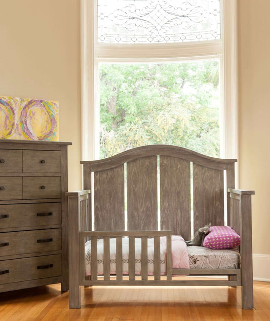 Relic Arch 4-in-1 Convertible Crib - Lifestyle Image Front View of 4-in-1 Convertible Crib Fossil with Guard Rail