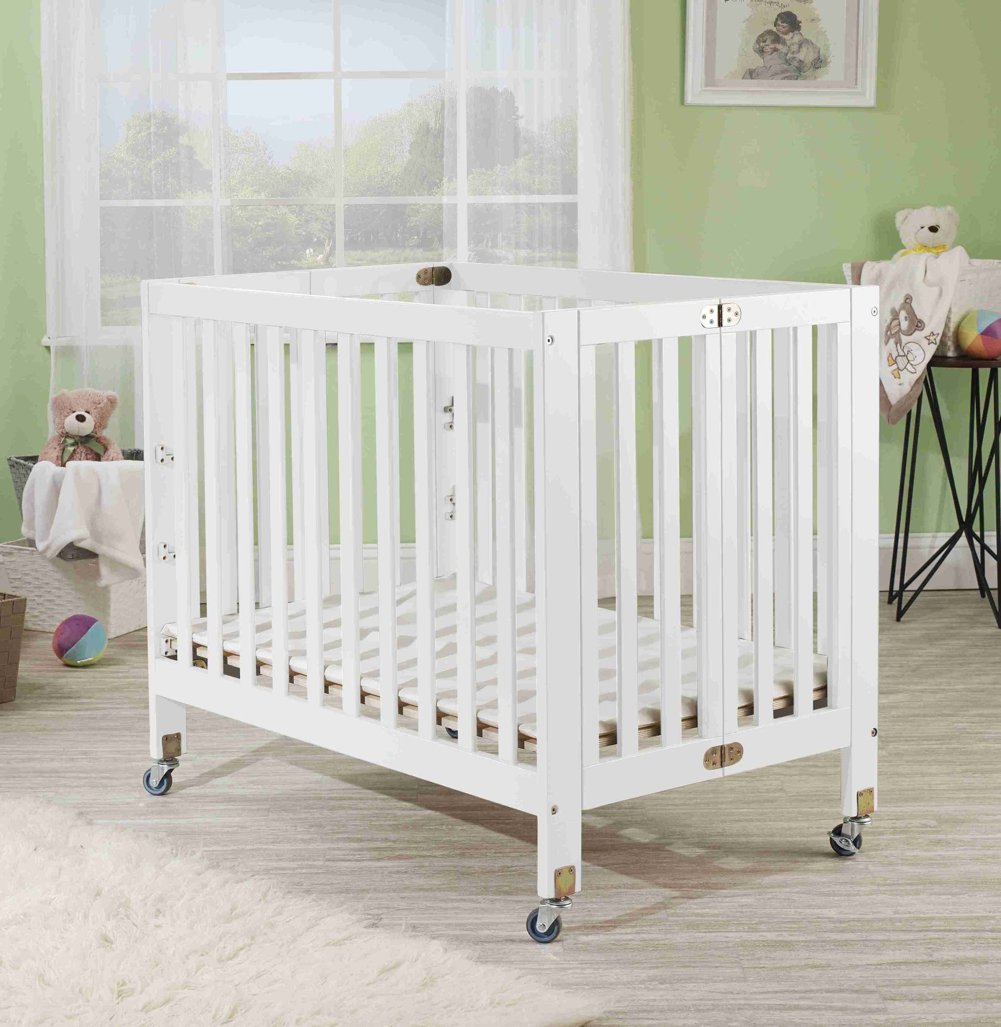 Roxy Three Level Mini Portable Folding Crib - Lifestyle Image of Mini Portable Crib White-1