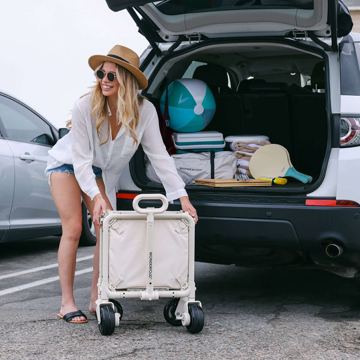 S5 Convertible Utility Wagon - Lifestyle Image of Woman Carrying S5 Convertible Utility Wagon Beige