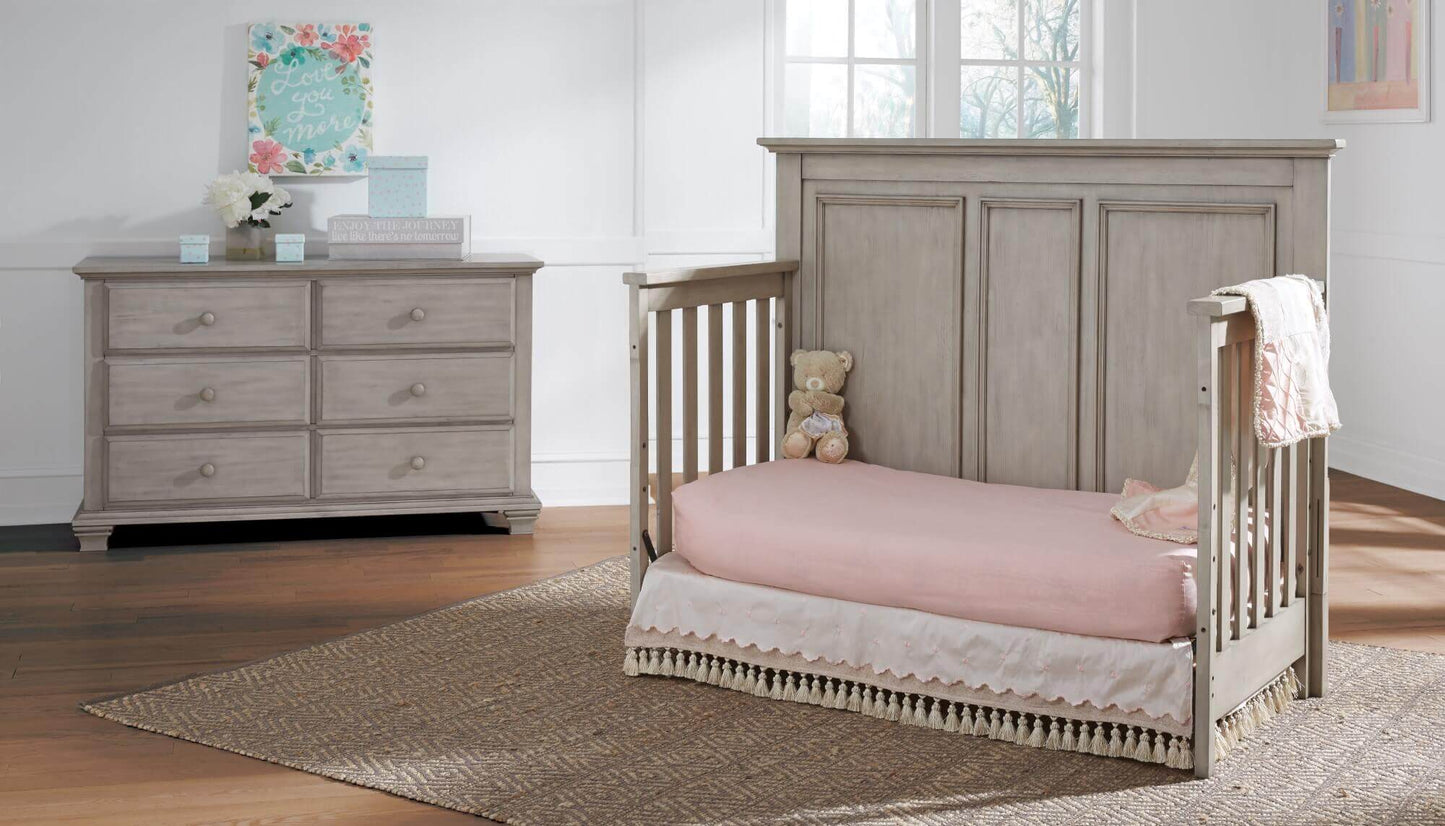 Kenilworth 4-in-1 Convertible Crib - Lifestyle Image Inclined Side View of Kenilworth Daybed Stone Wash
