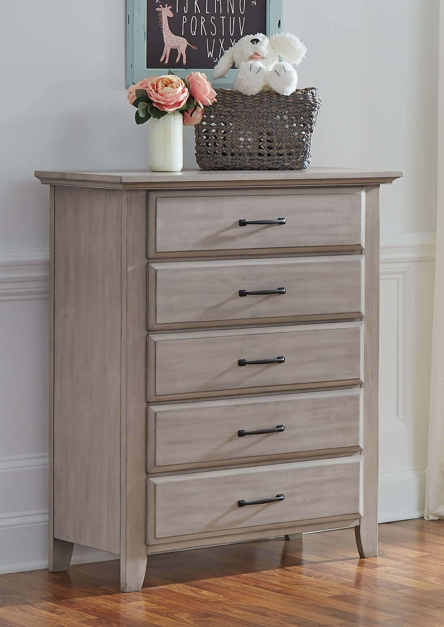 Chandler 5 Drawer Chest - Lifestyle Image Inclined Side View of Chandler 5 Drawer Chest Stone Wash