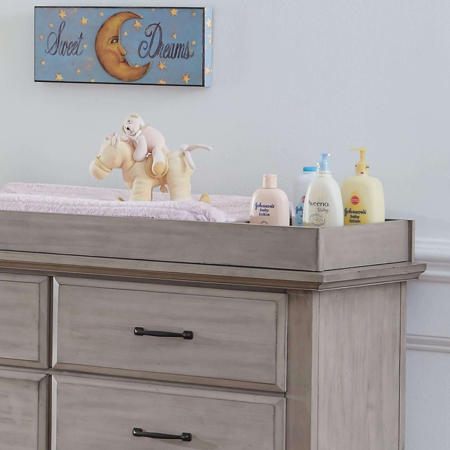 Chandler 6 Drawer Dresser - Zoomed Lifestyle Image Inclined Side View of Chandler 6 Drawer Dresser Stone Wash