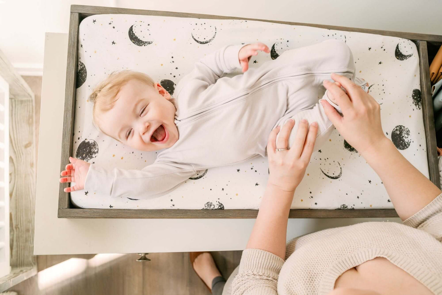 True Changer Tray - Lifestyle Image of Changer Tray Snow  with Mud with Mother Changing Daiper