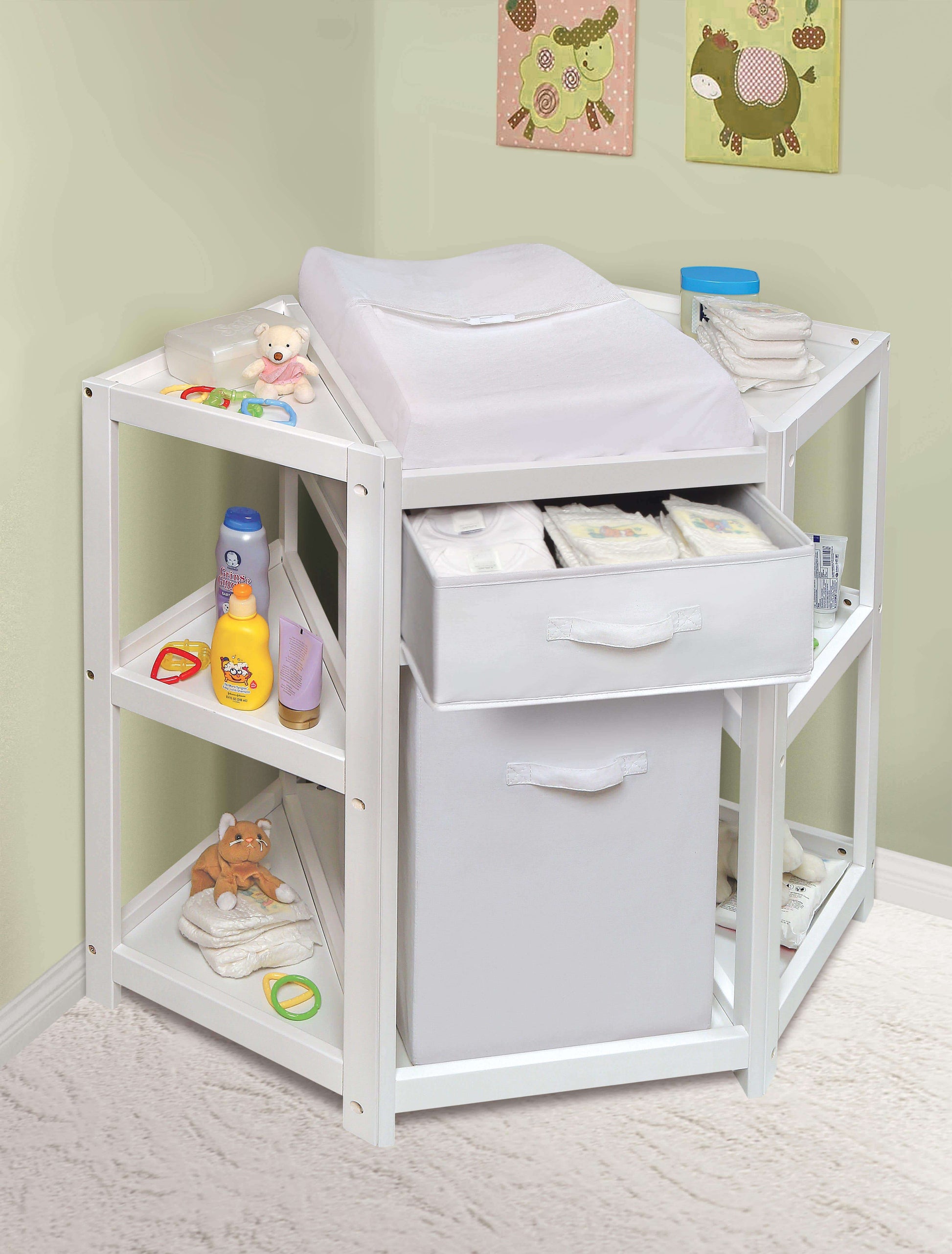 Diaper Corner Baby Changing Table with Hamper and Basket - Lifestyle Image Inclined Front View of Diaper Corner Baby Changing Table with Open Hamper and Basket White