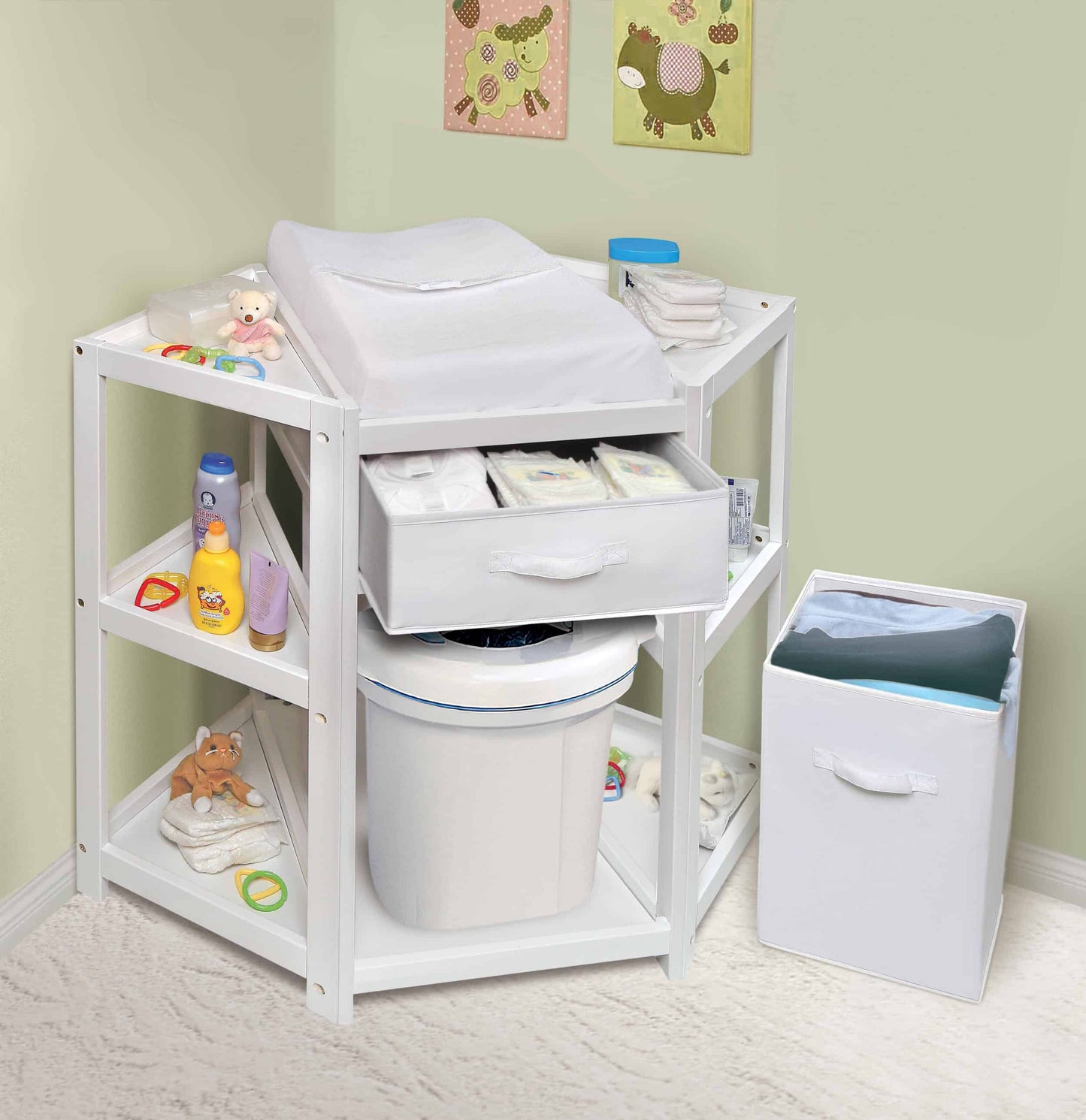 Diaper Corner Baby Changing Table with Hamper and Basket - Lifestyle Image Inclined Front View of Diaper Corner Baby Changing Table with Open Hamper and Out Basket White