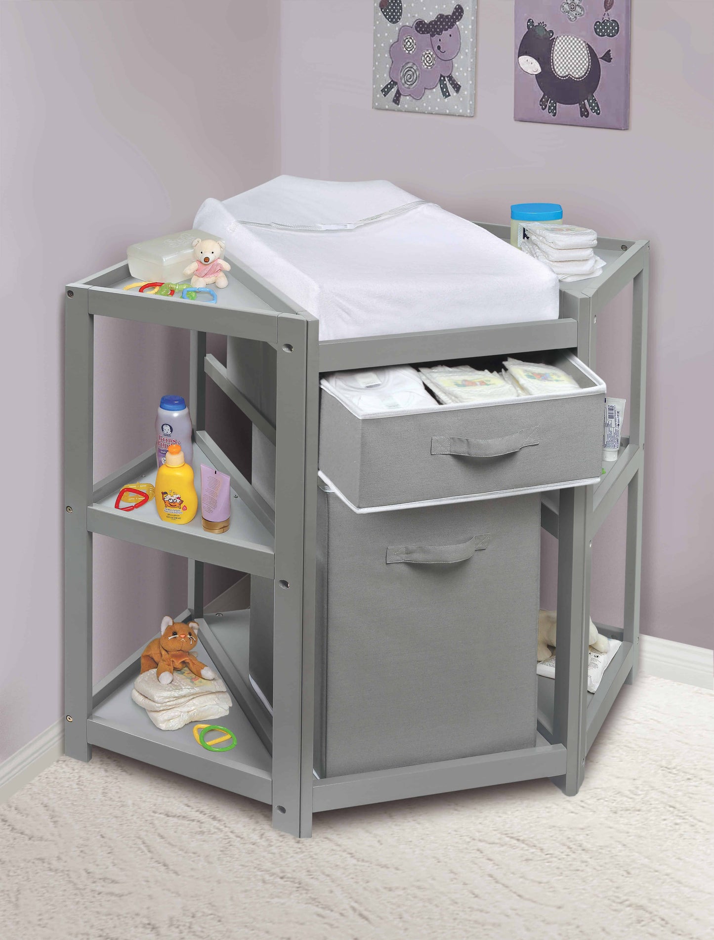 Diaper Corner Baby Changing Table with Hamper and Basket - Lifestyle Image Inclined Front View of Diaper Corner Baby Changing Table with Open Hamper and Basket Multi Tone Gray