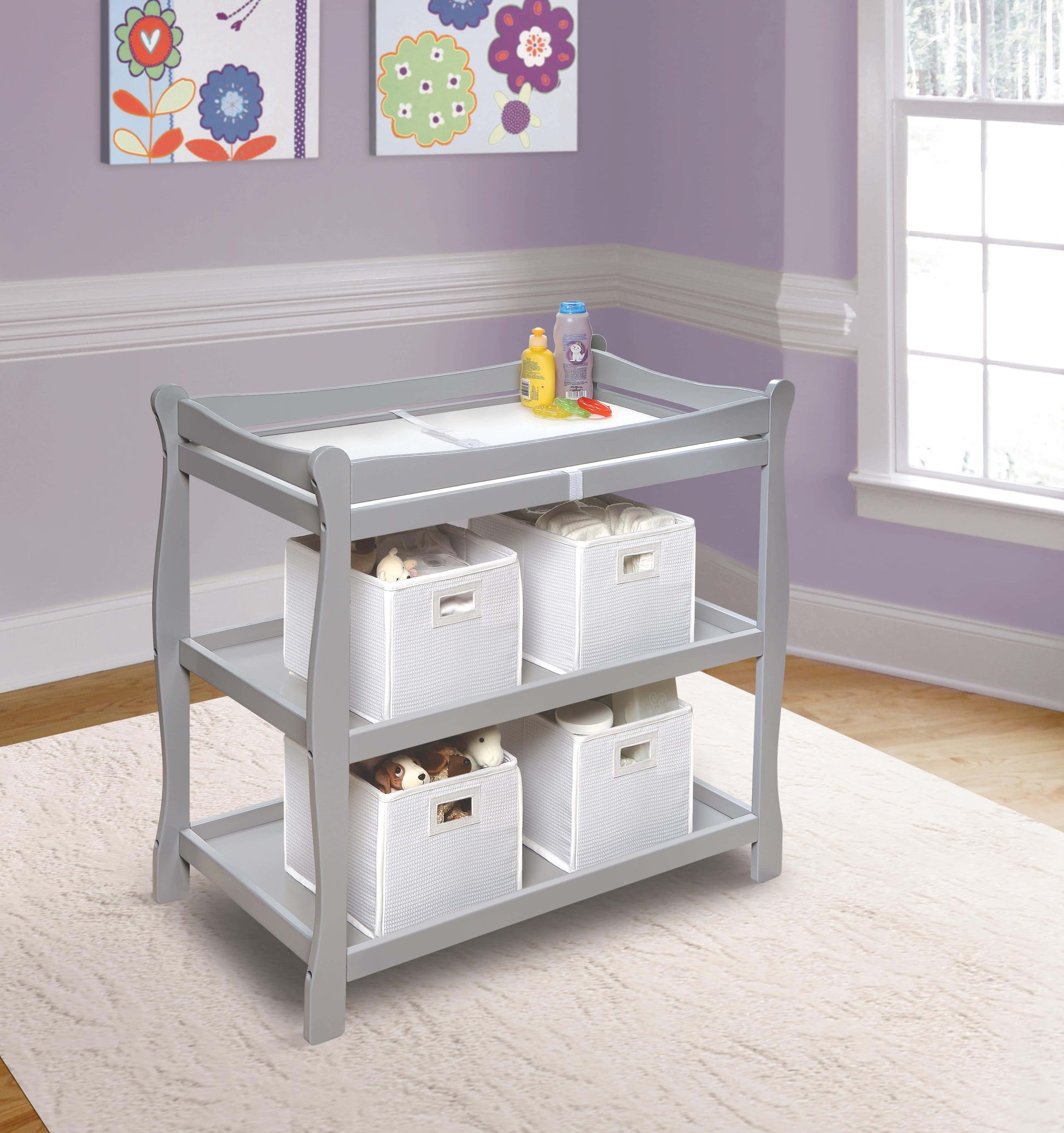 Sleigh Style Baby Changing Table - Lifestyle Image Inclined Side View of Sleigh Style Baby Changing Table Multi Tone Gray In Usage