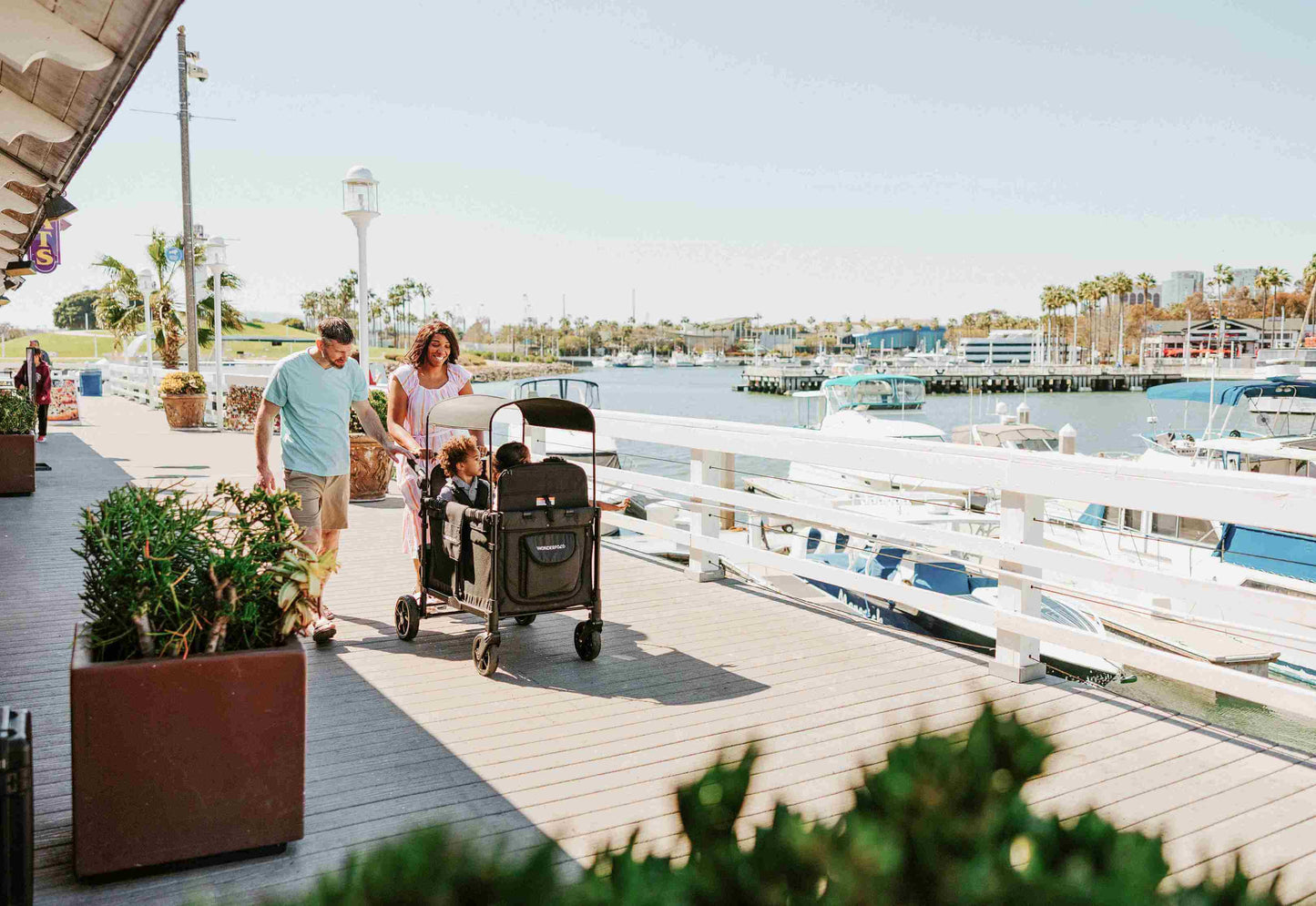 W4 Elite Quad Stroller Wagon - Lifestyle Image of Family enjoying with W4 Elite Quad Stroller Wagon Black