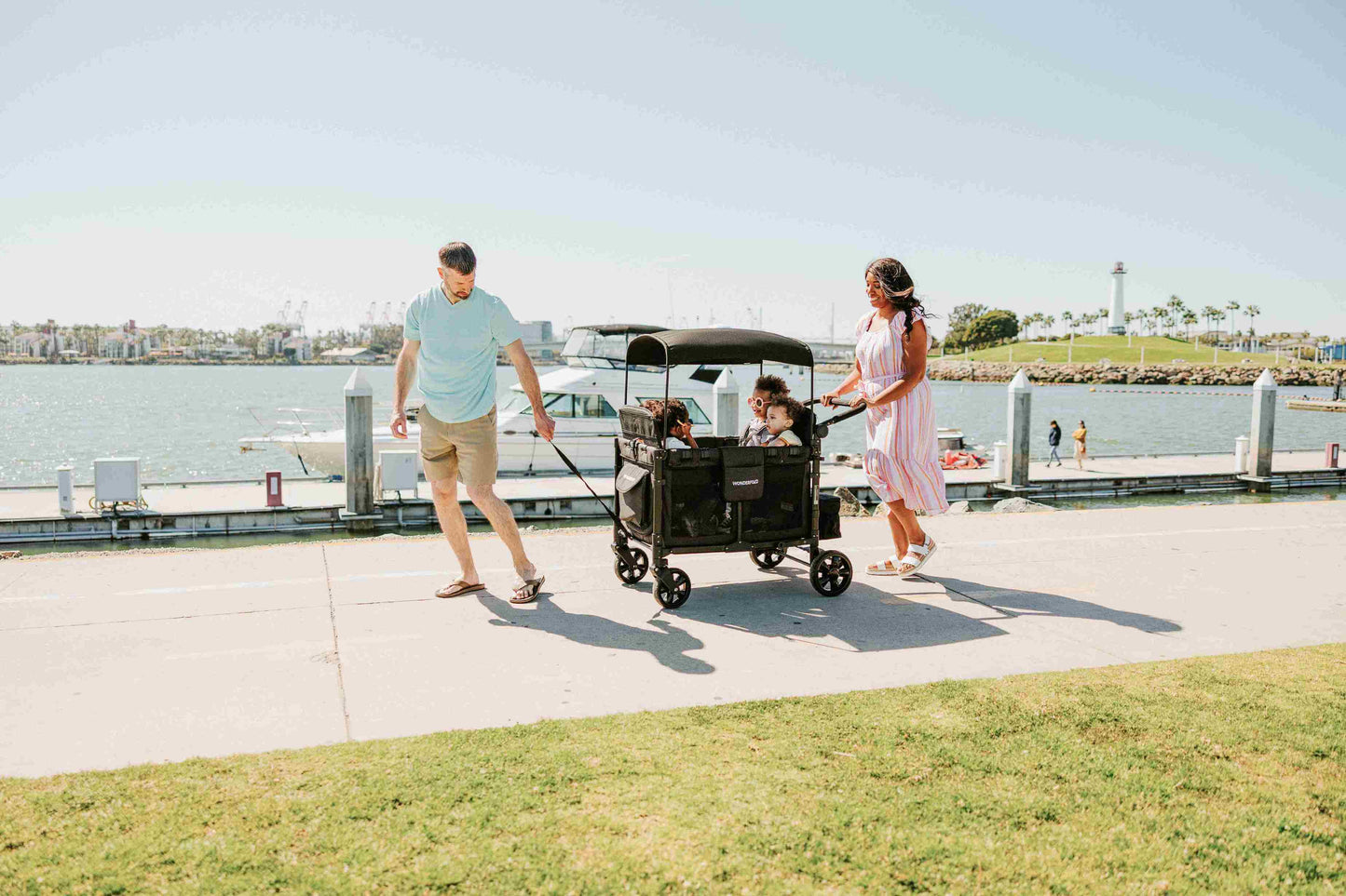 W4 Elite Quad Stroller Wagon - Lifestyle Image of Family Enjoying with W4 Elite Quad Stroller Wagon Black Camo