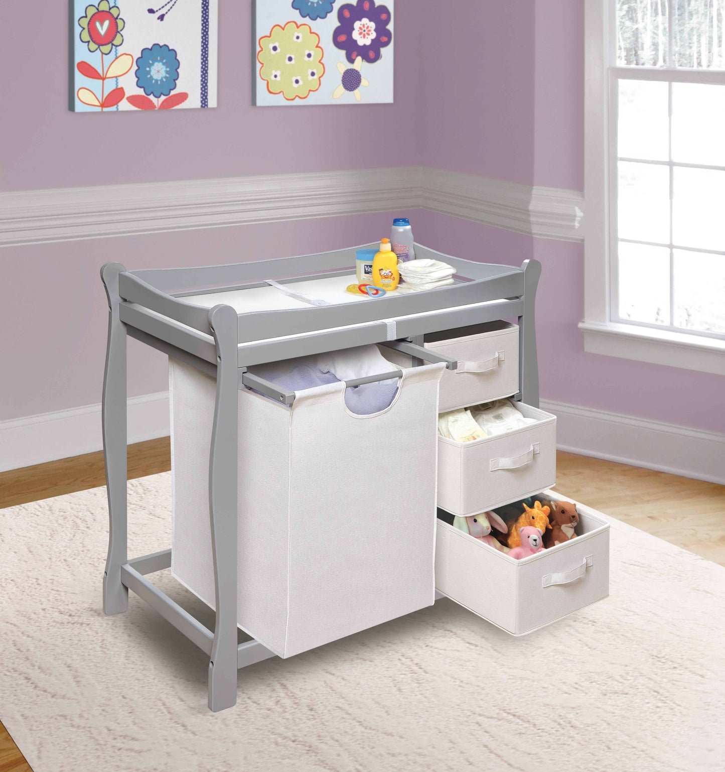 Sleigh Style Baby Changing Table with Hamper and 3 Baskets - Lifestyle Image Inclined Side View of Open Drawer Sleigh Style Baby Changing Table with Hamper and 3 Baskets Multi Tone Gray