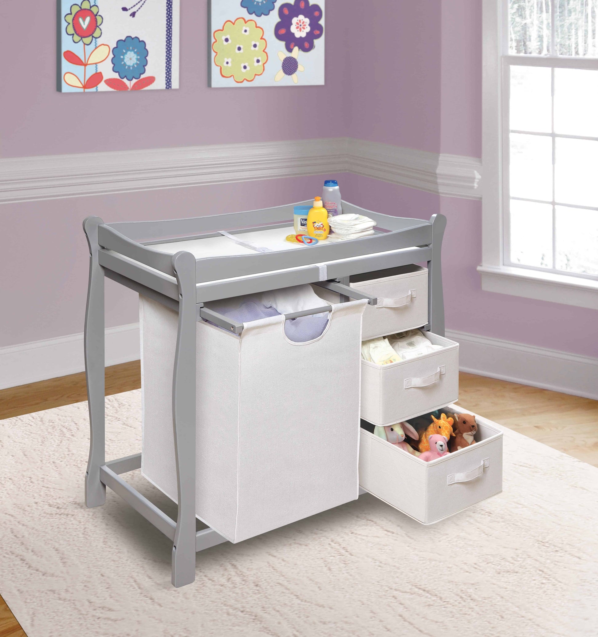 Sleigh Style Baby Changing Table with Hamper and 3 Baskets - Lifestyle Image Inclined Side View of Open Drawer Sleigh Style Baby Changing Table with Hamper and 3 Baskets Multi Tone Gray