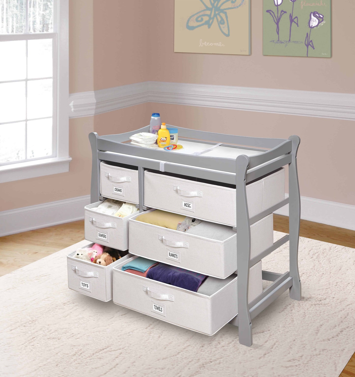 Sleigh Style Baby Changing Table with 6 Baskets -Lifestyle Image Inclined Side View of Sleigh Open Drawer Style Baby Changing Table with 6 Baskets Multi Tone Gray