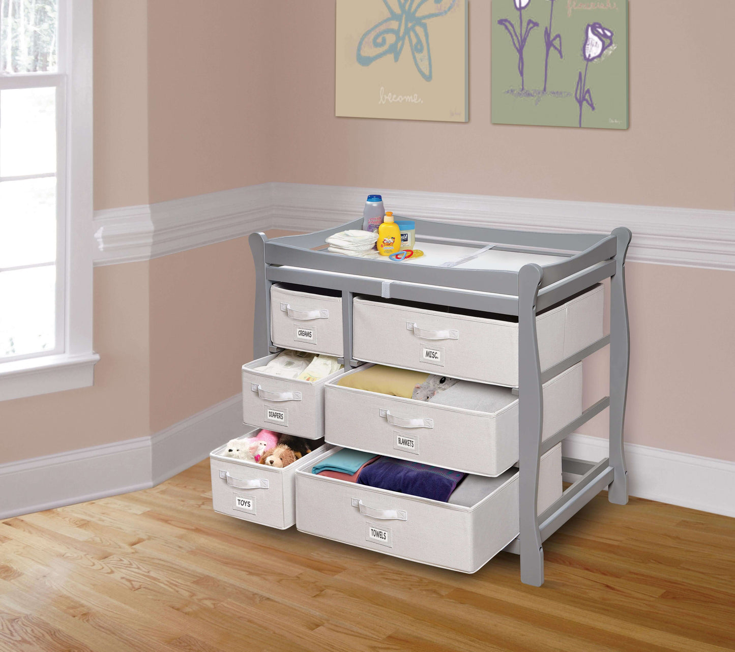 Sleigh Style Baby Changing Table with 6 Baskets -Lifestyle Image Inclined Side View of Sleigh Open Drawer Style Baby Changing Table with 6 Baskets Multi Tone Gray
