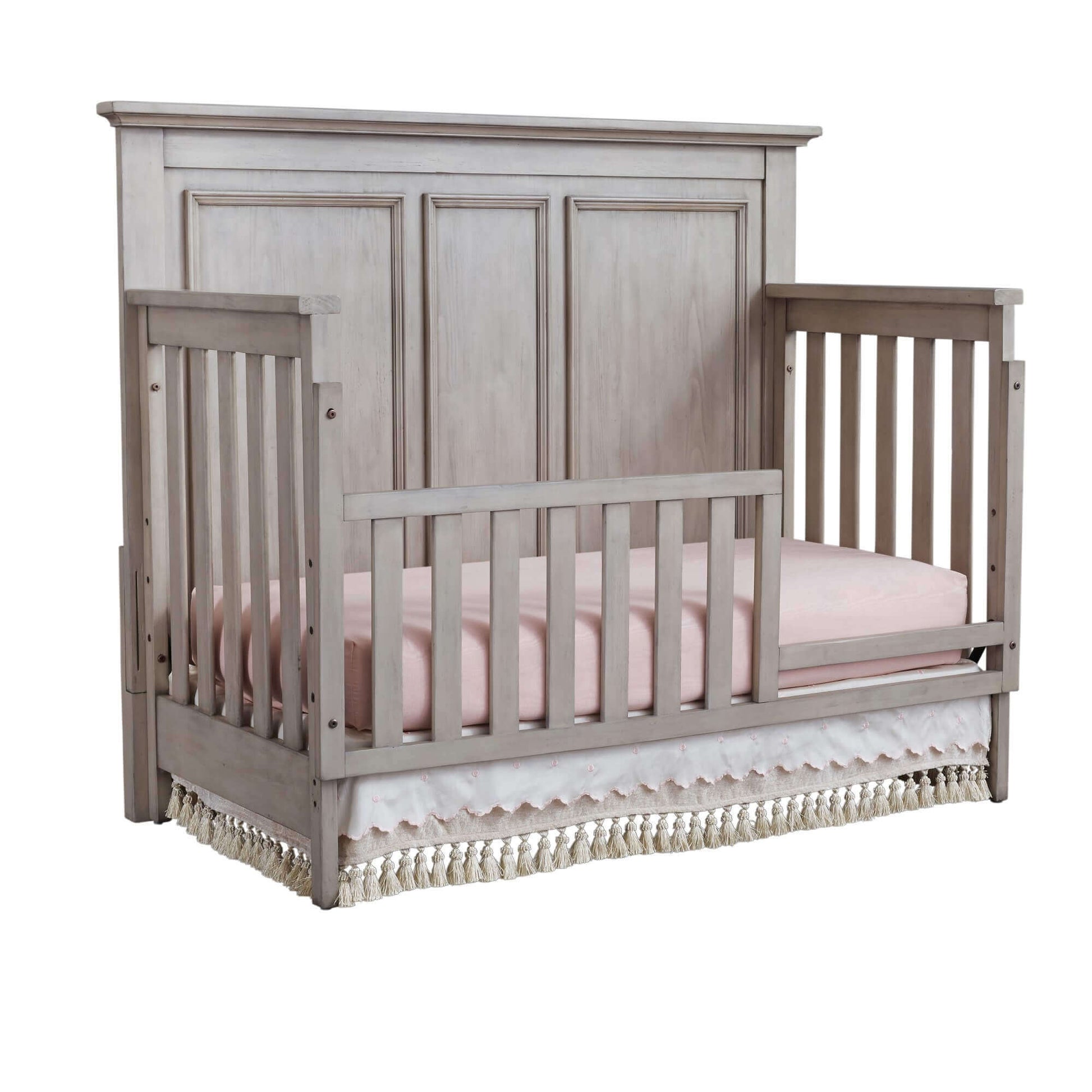 Kenilworth 4-in-1 Convertible Crib - Inclined Side View of Kenilworth 4-in-1 Convertible Crib Stone Wash with Guard Rail