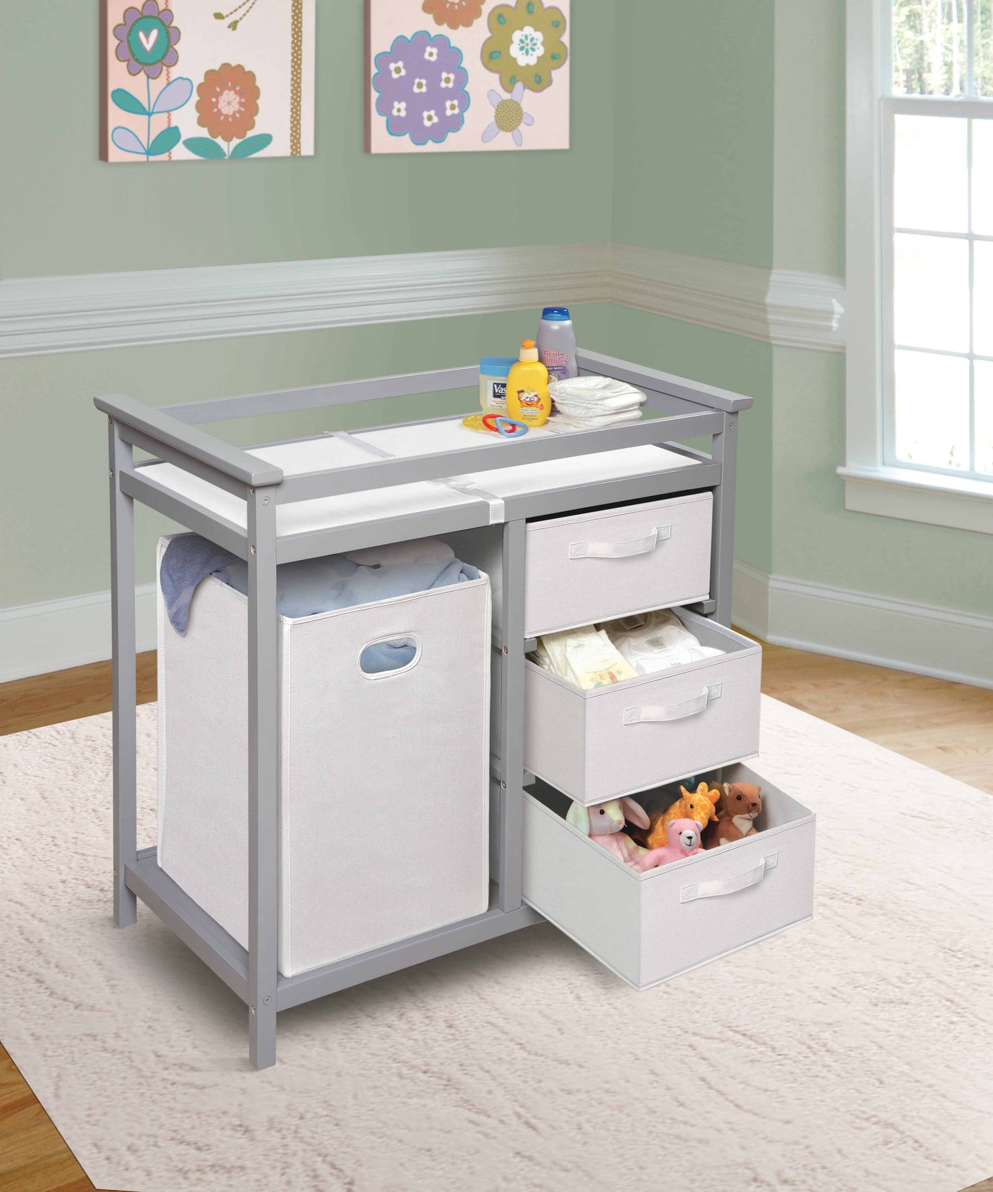 Modern Baby Changing Table with Hamper and 3 Baskets - Lifestyle Image Inclined Side View of Open Drawer Modern Baby Changing Table with Hamper and 3 Baskets Multi tone Gray