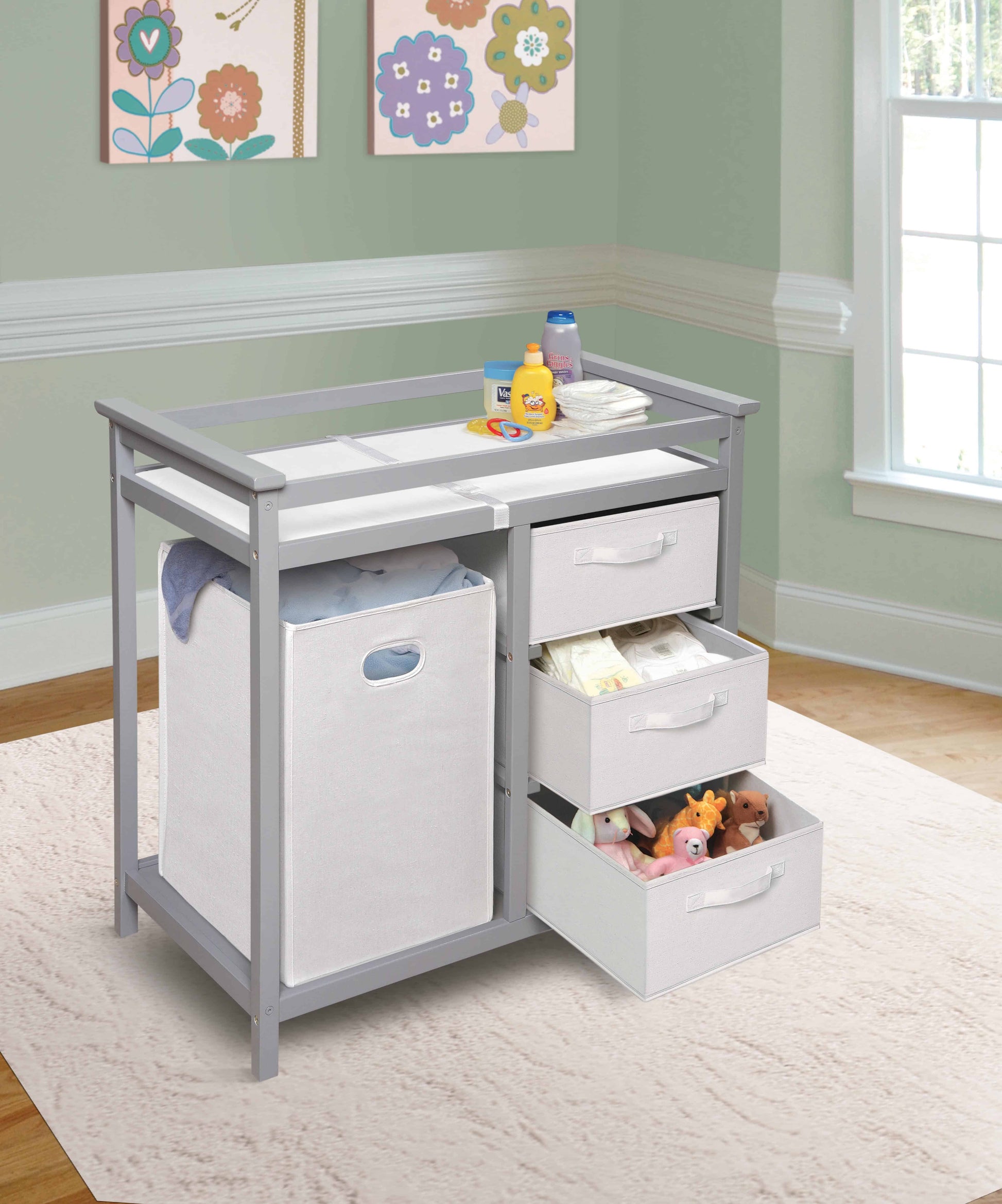 Modern Baby Changing Table with Hamper and 3 Baskets - Lifestyle Image Inclined Side View of Open Drawer Modern Baby Changing Table with Hamper and 3 Baskets Multi tone Gray