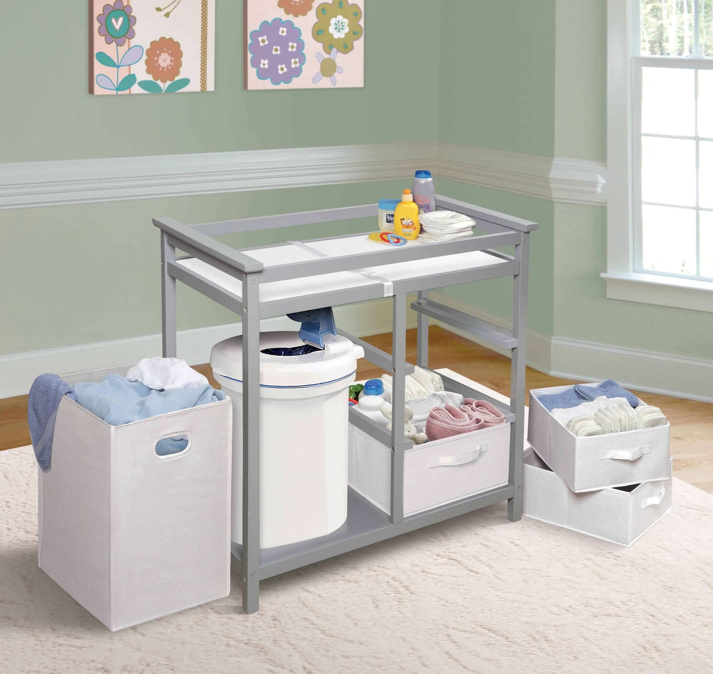 Modern Baby Changing Table with Hamper and 3 Baskets - Lifestyle Image Inclined Side View of Modern Baby Changing Table with Removeable Hamper and 3 Baskets Multi tone Gray