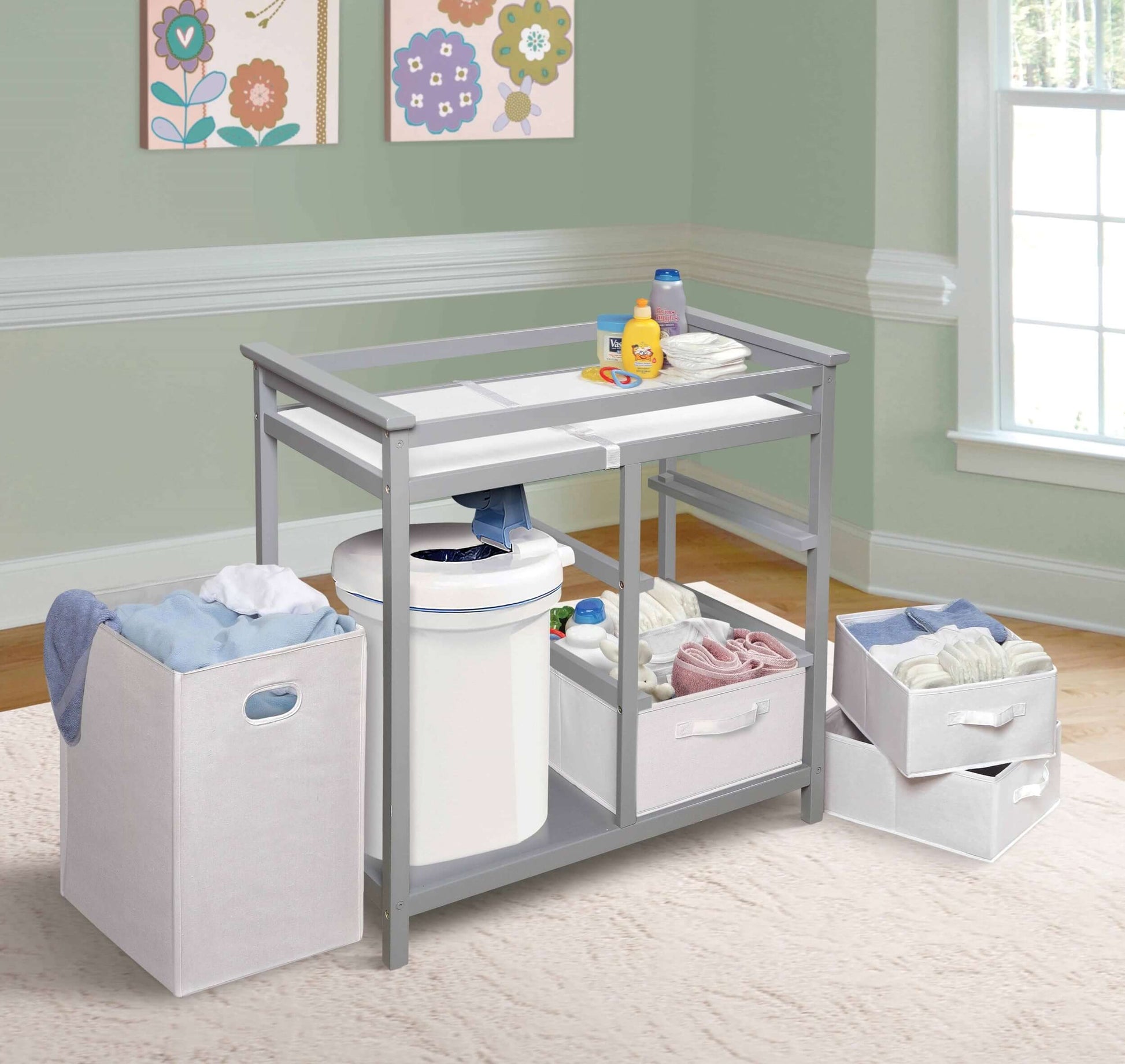 Modern Baby Changing Table with Hamper and 3 Baskets - Lifestyle Image Inclined Side View of Modern Baby Changing Table with Removeable Hamper and 3 Baskets Multi tone Gray