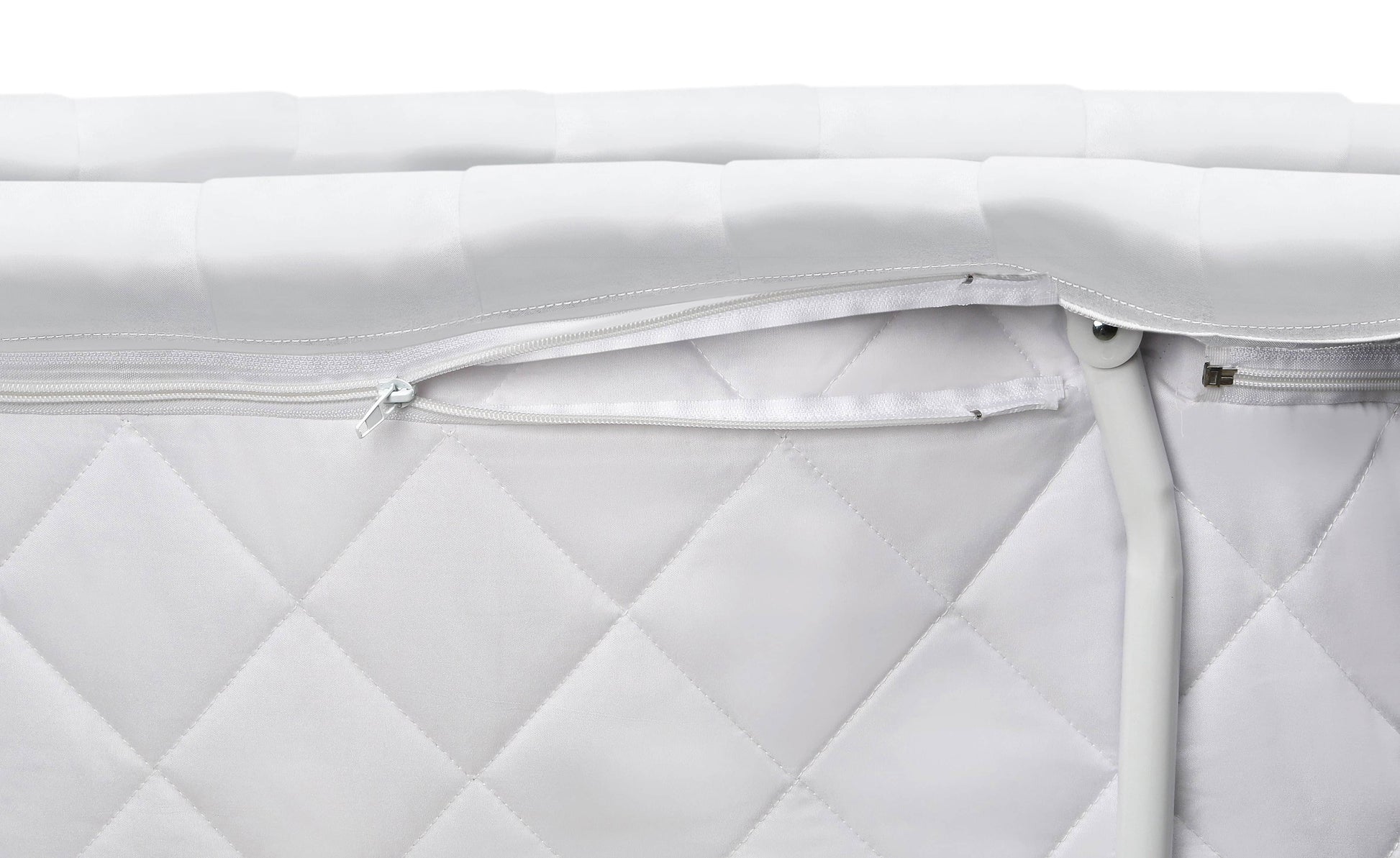 Wishes Oval Bassinet - Front View of Storage Unit with Zip of Wishes Oval Bassinet White Bedding