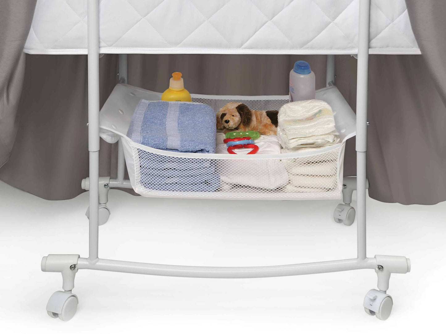Wishes Oval Bassinet -  - Inclined Side View of Storage of Wishes Oval Bassinet Gray bedding
