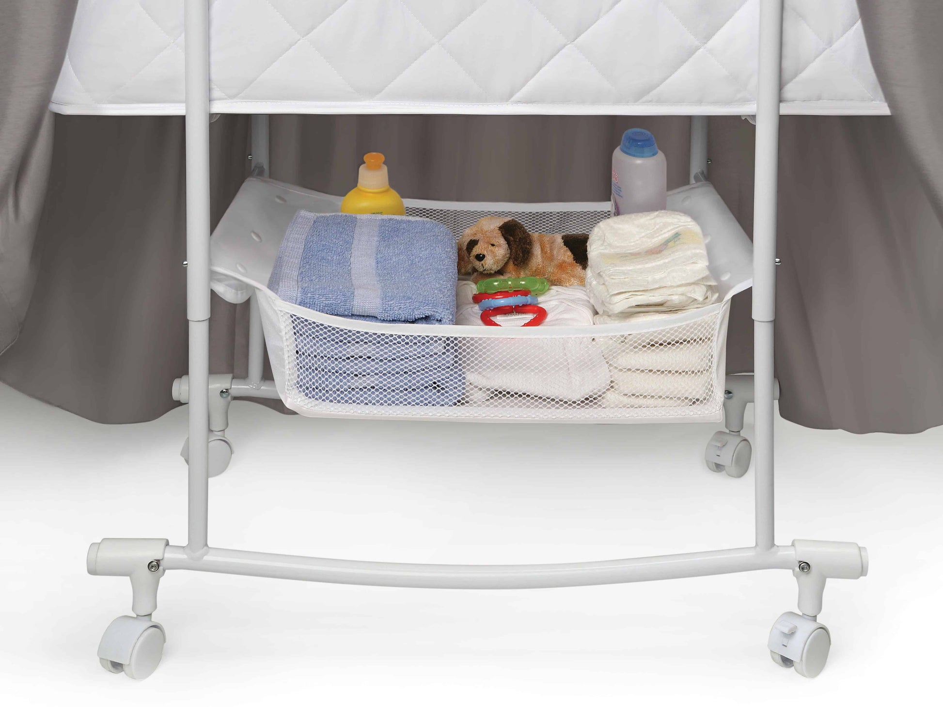 Wishes Oval Bassinet -  - Inclined Side View of Storage of Wishes Oval Bassinet Gray bedding