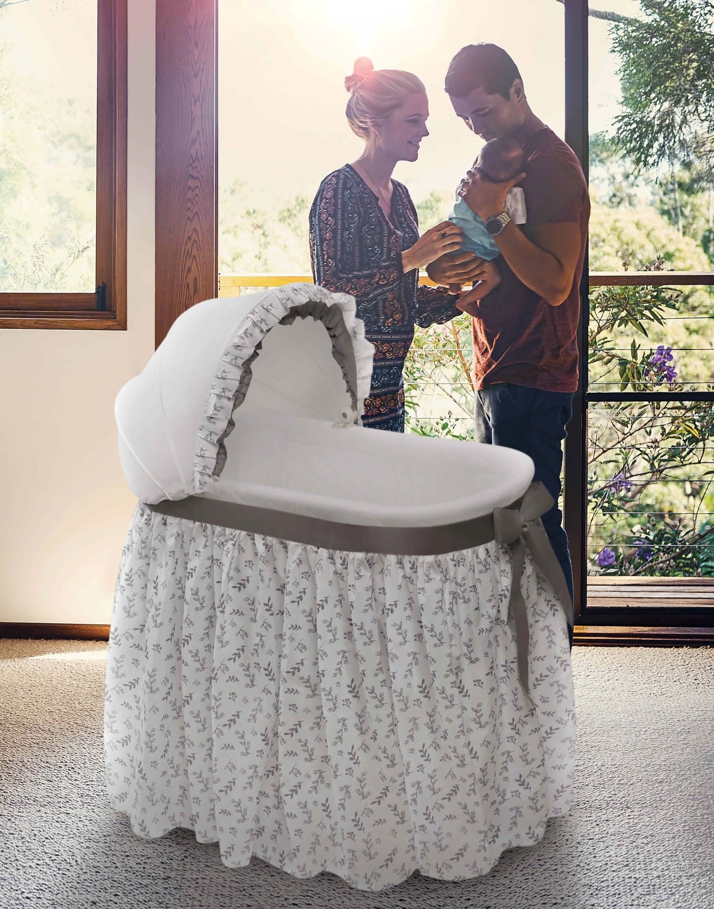 Wishes Oval Bassinet - Lifestyle Image of Parent Playing with there Baby Around Wishes Oval Bassinet White-1