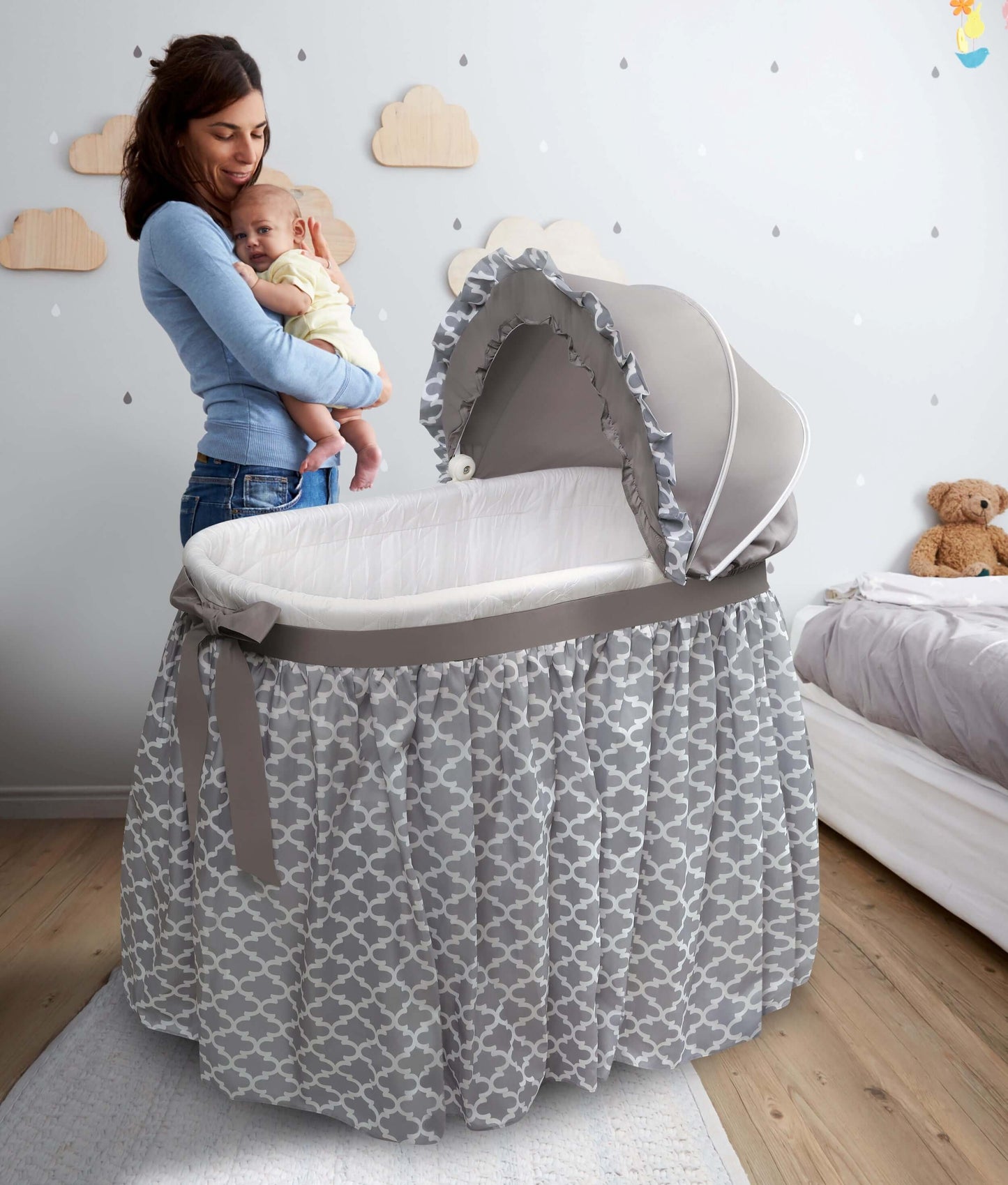 Wishes Oval Bassinet - Lifestyle Image of Mother Holding the Baby Around Wishes Oval Bassinet White