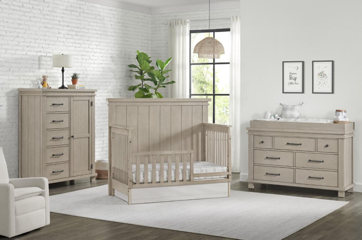 Hampton 4 In 1 Convertible Crib - Lifestyle Image Inclined Side View of Hampton 4 In 1 Convertible Crib Stone Wash with Guard Rail