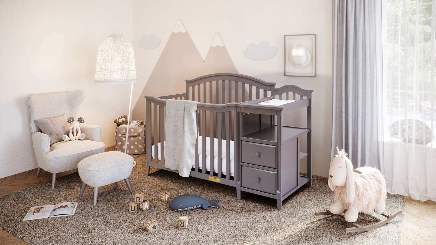 Kali 4-in-1 Crib and Changer - Full Lifestyle Image Inclined Side View of Kali 4-in-1 Crib and Changer Gray