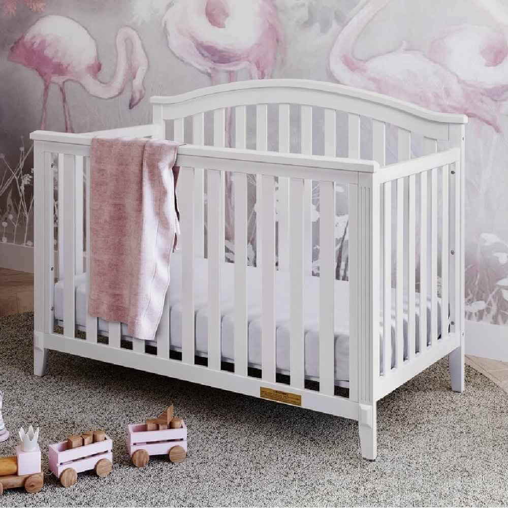 Kali II 4-in-1 Crib (Flat Footboard) - Lifestyle Image Inclined Side View of Kali II 4-in-1 Crib White