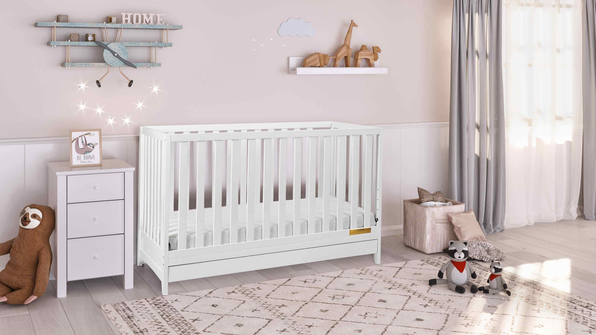 Mila 3-in-1 Convertible Crib with Drawer - Full Lifestyle Image Inclined Side View of Mila 3-in-1 Convertible Crib with Drawer White
