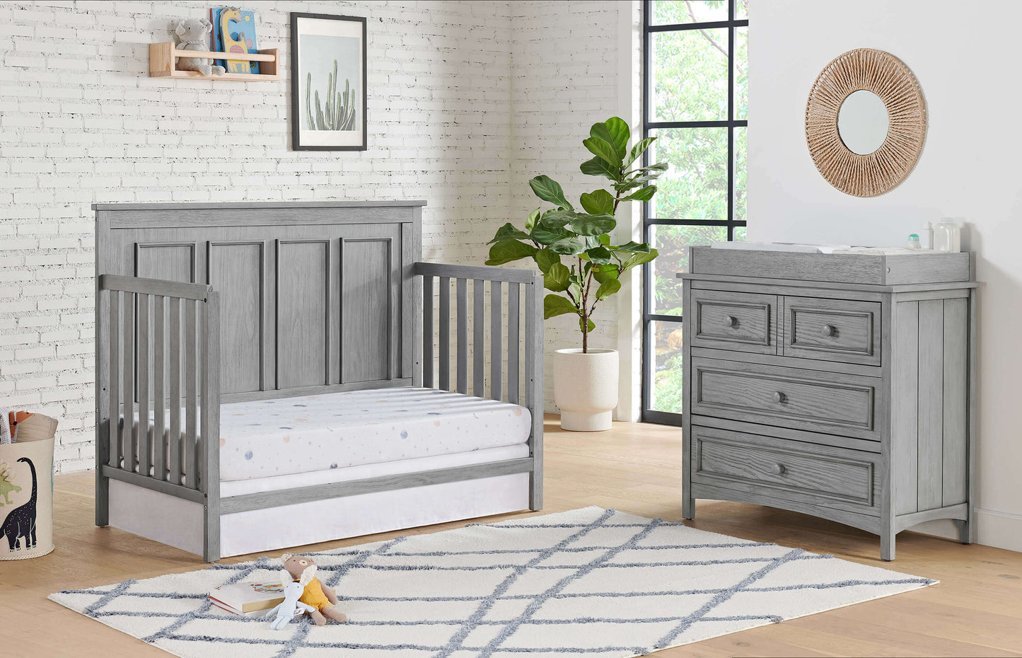 Bennett 4-in-1 Convertible Crib - Lifestyle Image Inclined Side View of Bennett Daybed Rustic Gray