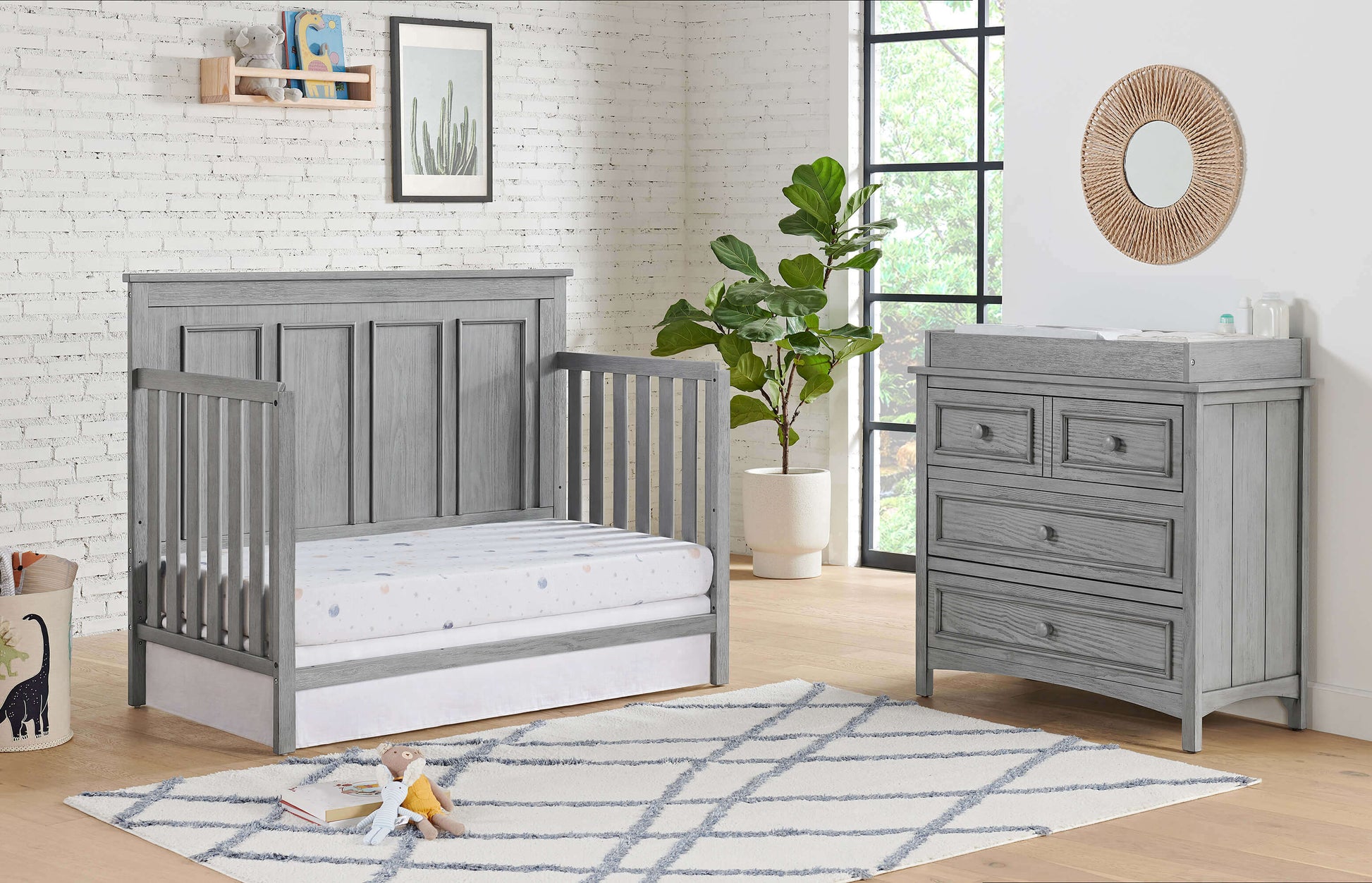 Bennett 4-in-1 Convertible Crib - Lifestyle Image Inclined Side View of Bennett Daybed Rustic Gray