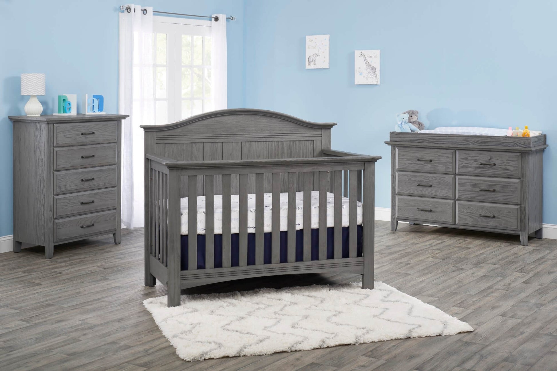 Chandler 4 In 1 Convertible Crib - Lifestyle Image Inclined Side View of Chandler 4 In 1 Convertible Crib Graphite Gray