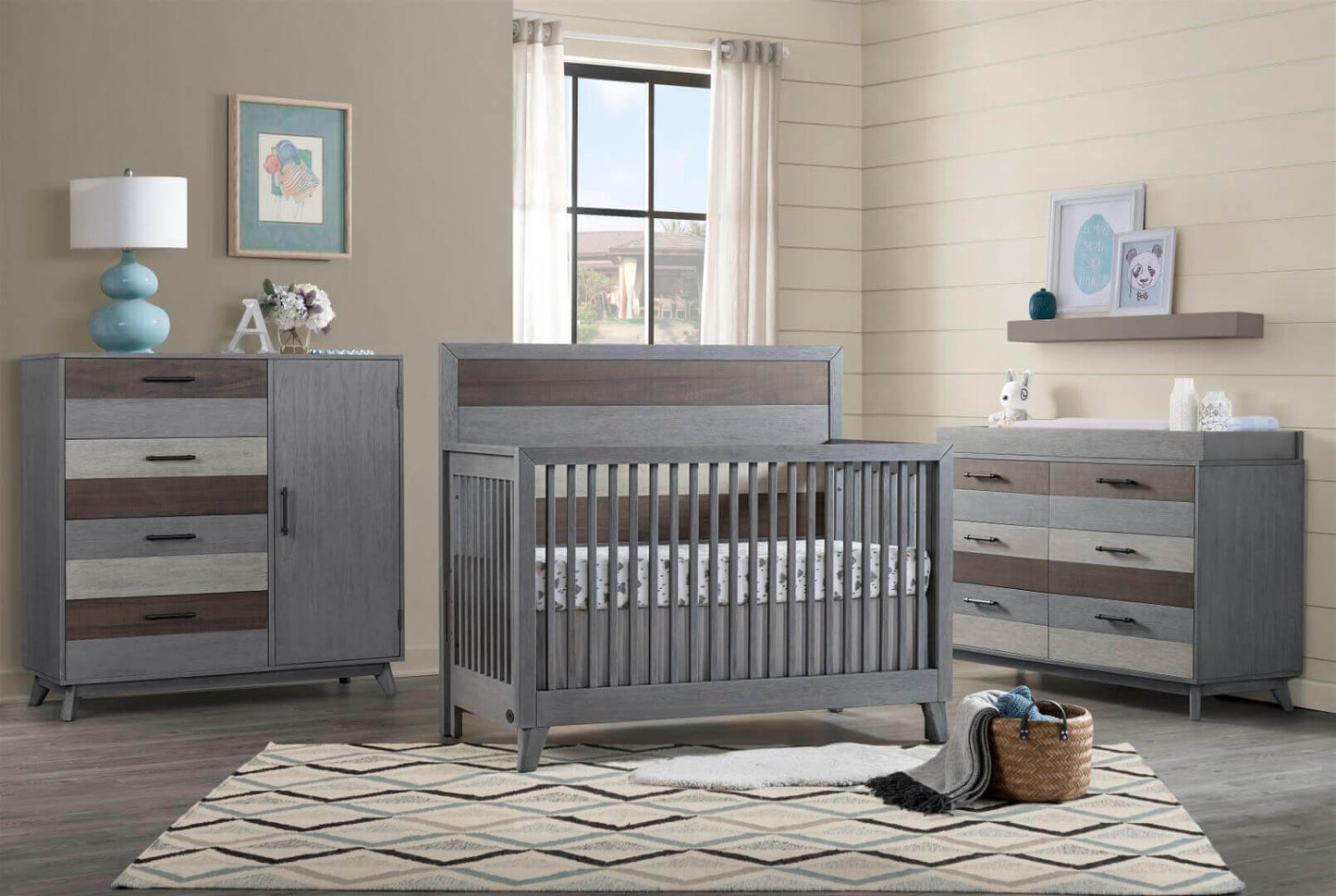 Cascade Chifferobe - Lifestyle Image Side View of Inclined Side View of Cascade Chifferobe Multi Tone Gray Beside Cascade Crib
