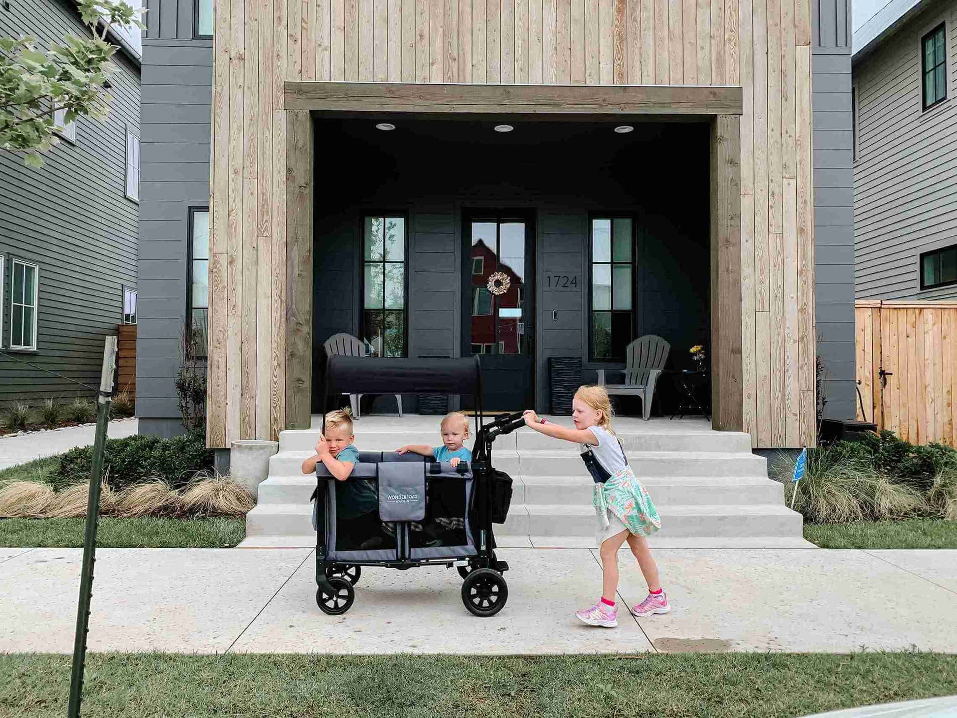 W2 Original + Double Stroller Wagon - Lifestyle Image of Teenager With Toddler on W2 Original + Double Stroller Wagon Gray
