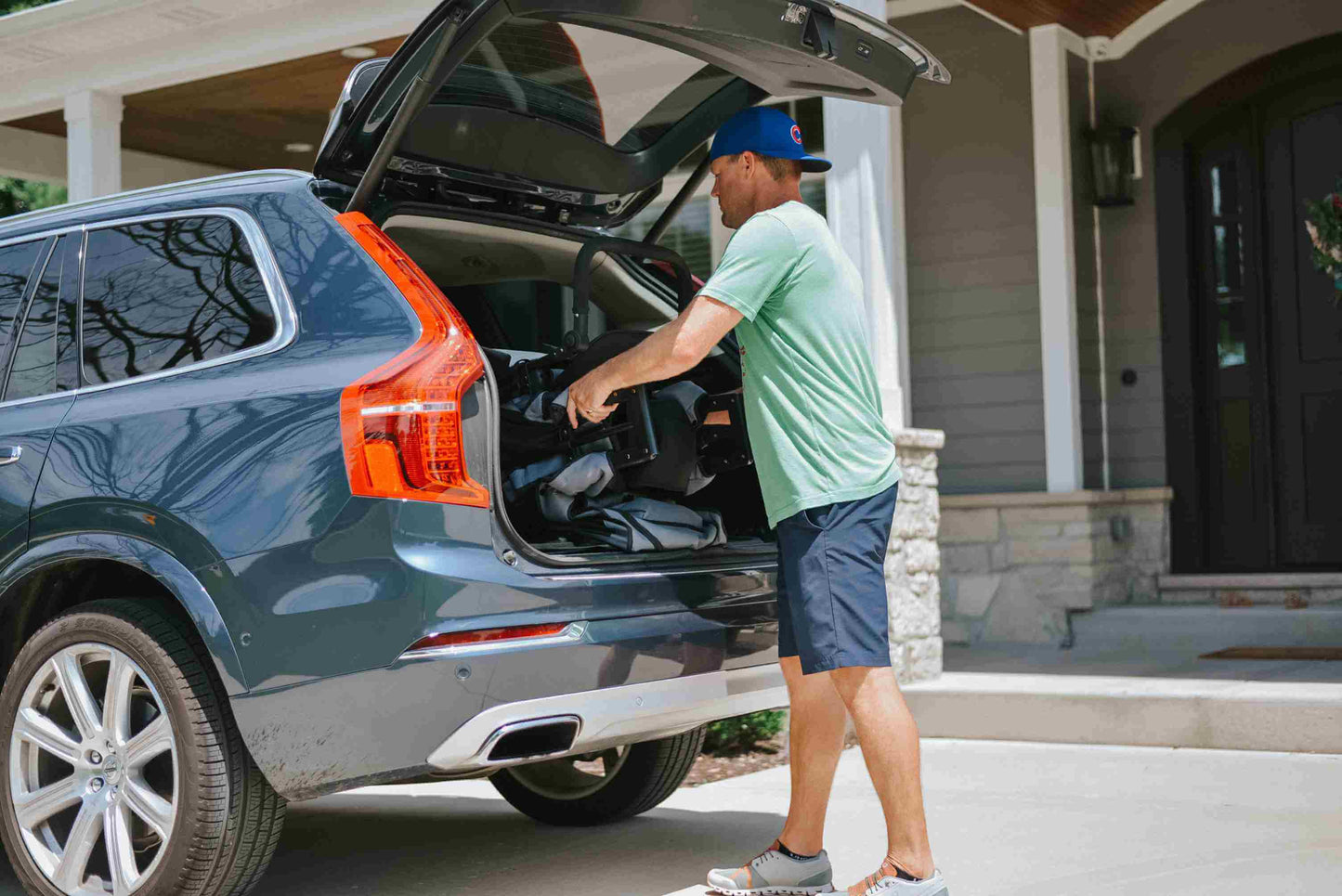 W2 Original + Double Stroller Wagon - Lifestyle Image of Man taking W2 Original + Double Stroller Wagon Gray Out of Car