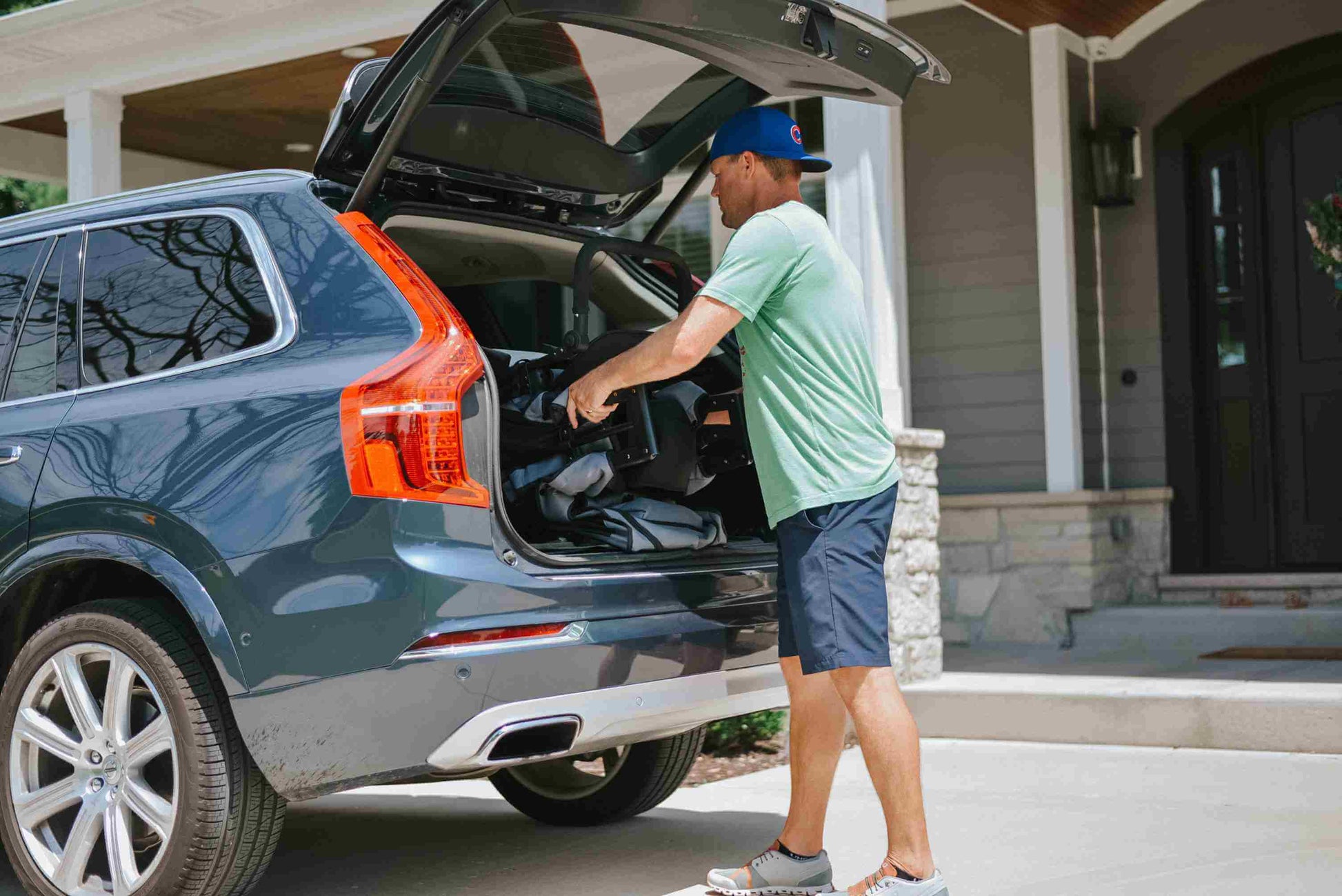 W2 Original + Double Stroller Wagon - Lifestyle Image of Man taking W2 Original + Double Stroller Wagon Gray Out of Car