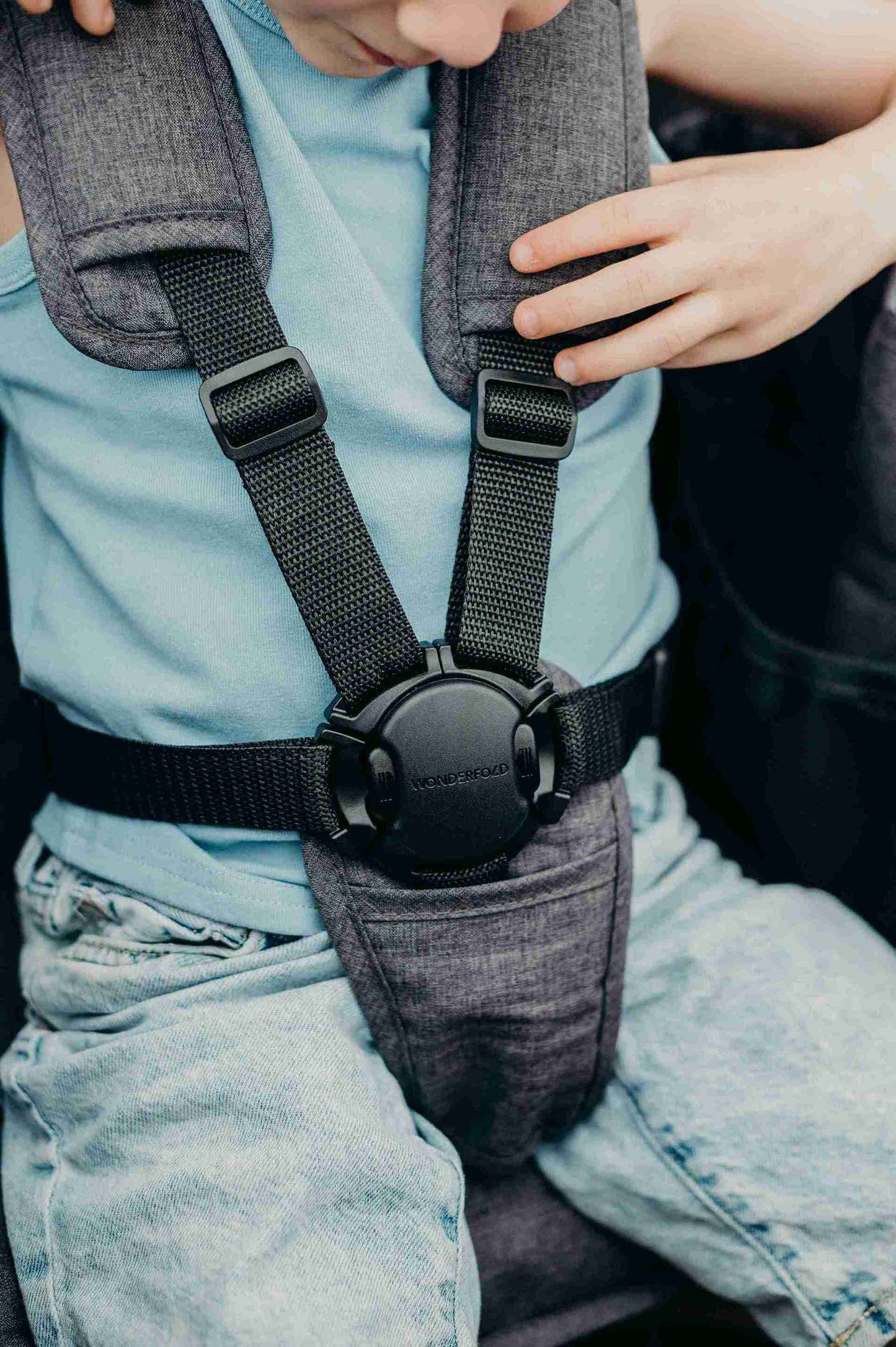 W2 Elite Double Stroller Wagon - Zoomed Lifestyle Image Baby Harness of W2 Elite Double Stroller Wagon Gray