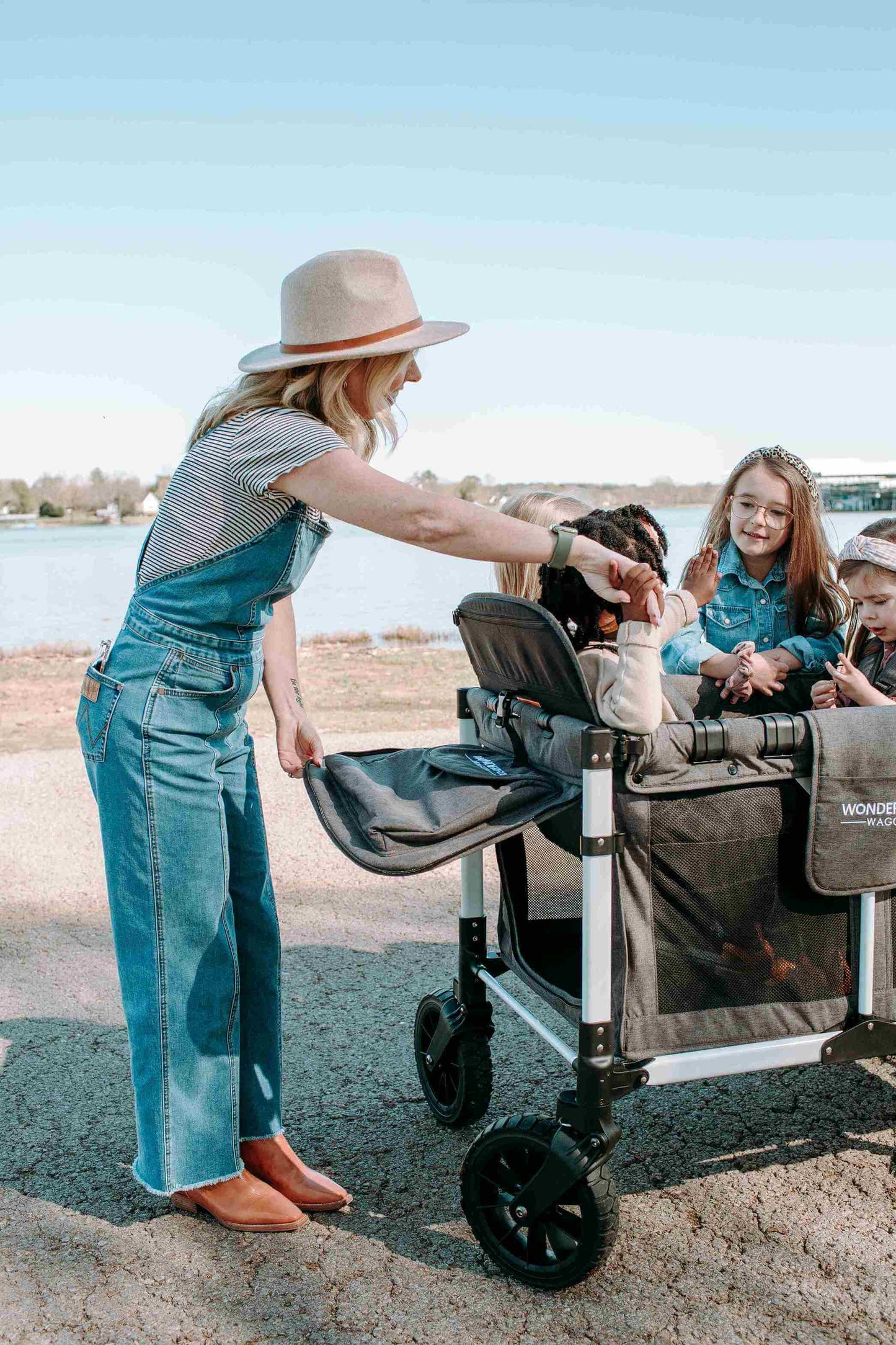 W4 Luxe Quad Stroller Wagon - Lifestyle Image Zoomed View of Mother and Toddler on W4 Luxe Quad Stroller Wagon Gray