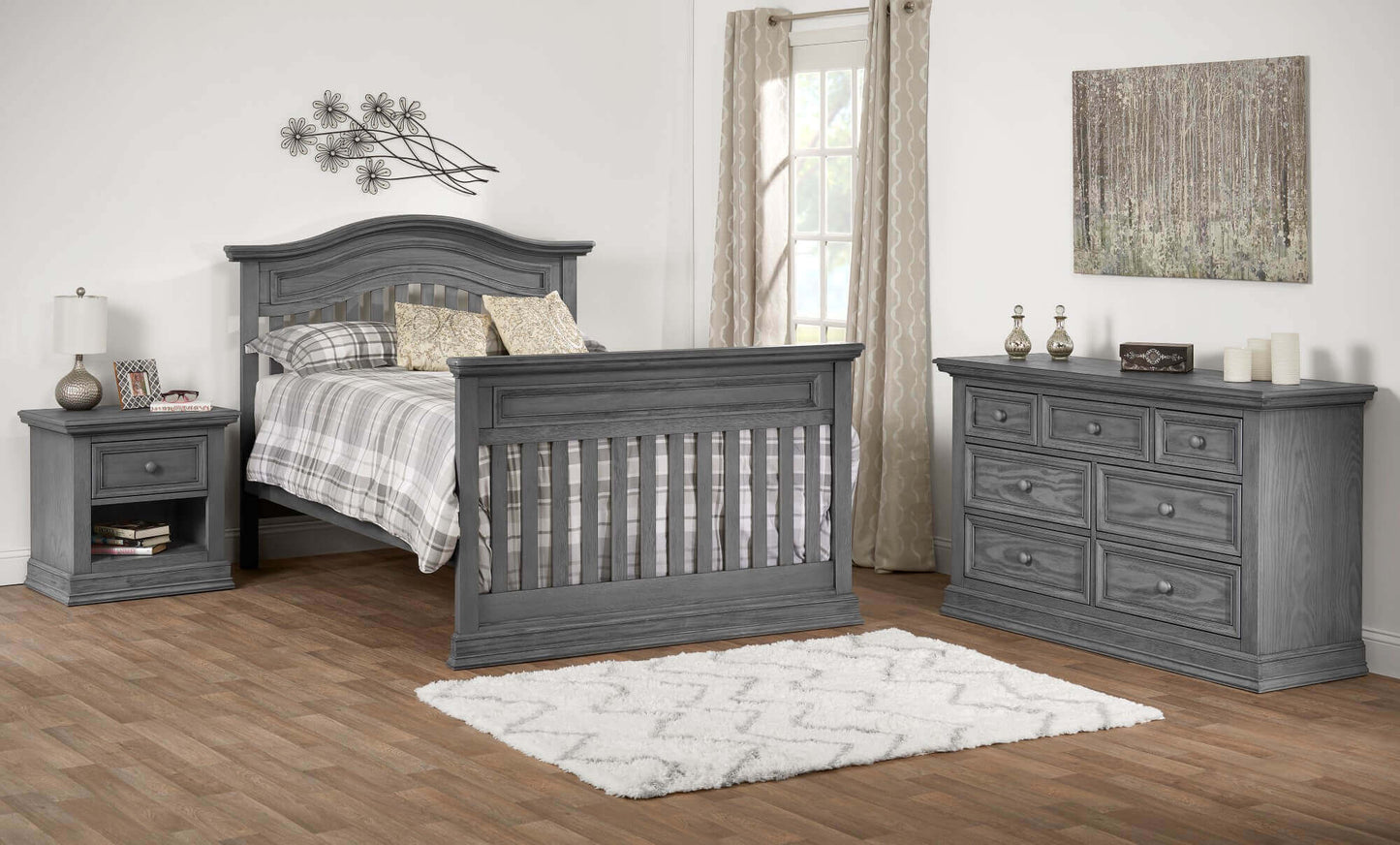 Glenbrook 4-in-1 Convertible Crib - Lifestyle Image Inclined Side View of Glenbrook Full Sized Bed Graphite Gray
