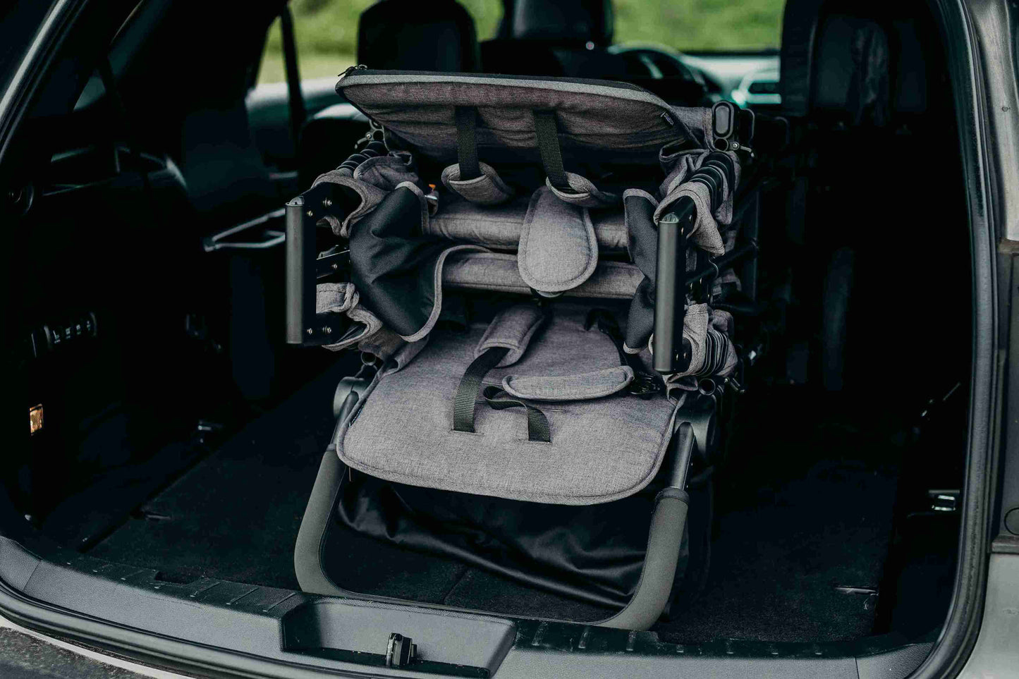 W2 Elite Double Stroller Wagon - Lifestyle Image of Folded W2 Elite Double Stroller Wagon Placed in Car