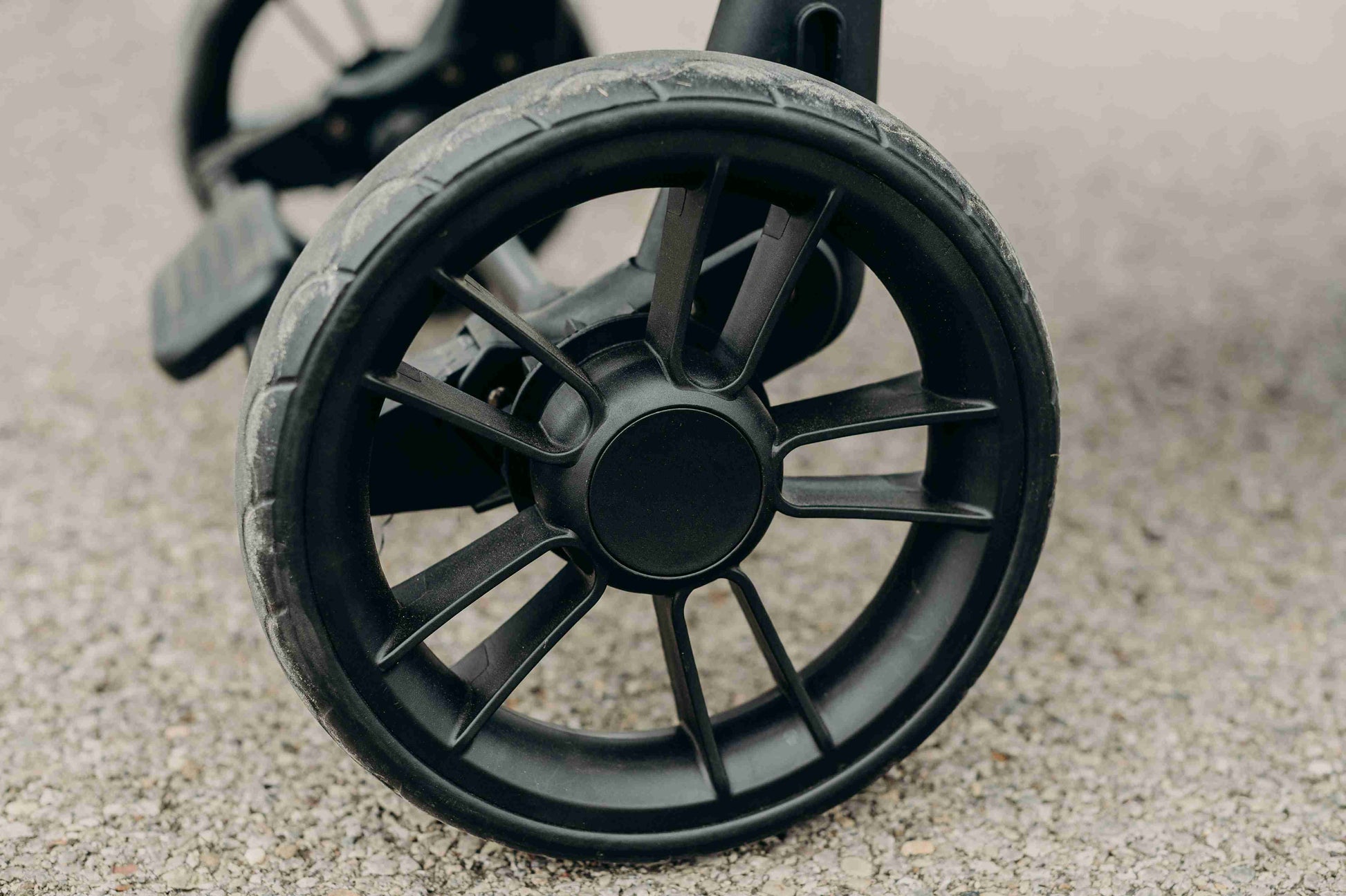 W2 Elite Double Stroller Wagon - Lifestyle Image of Rolling Wheels of W2 Elite Double Stroller Wagon Black