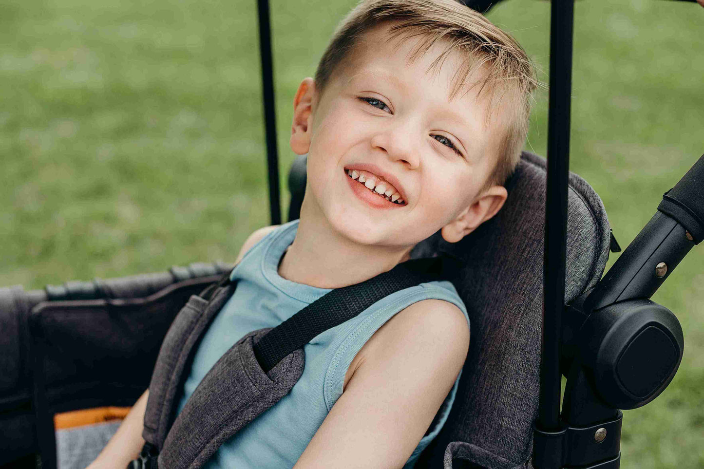 W2 Elite Double Stroller Wagon - Zoomed Lifestyle Image of Toddler on W2 Elite Double Stroller Wagon Gray