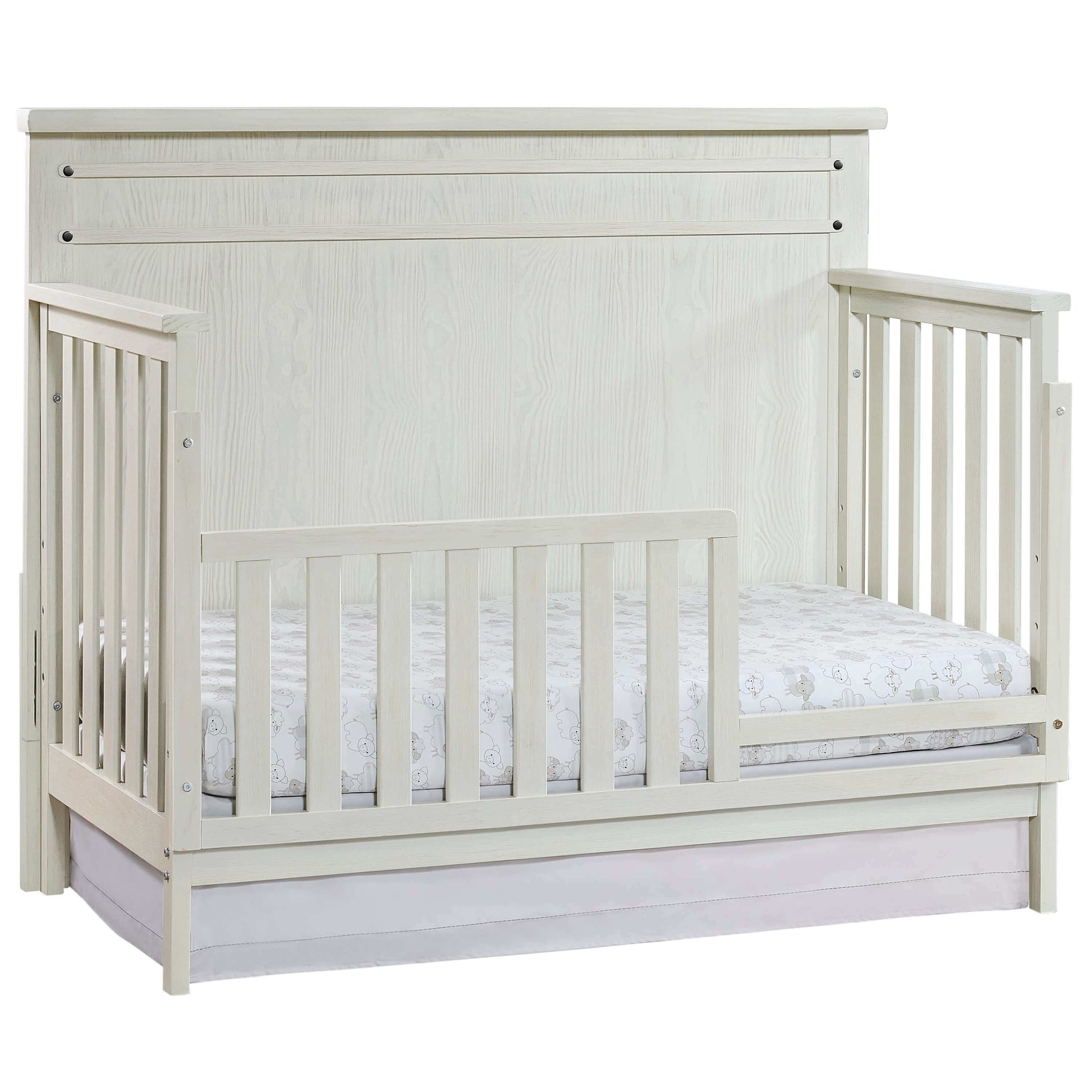Ellison 4 In 1 Convertible Crib - Inclined Side View of Ellison 4 In 1 Convertible Crib Rustic White with Guard Rail