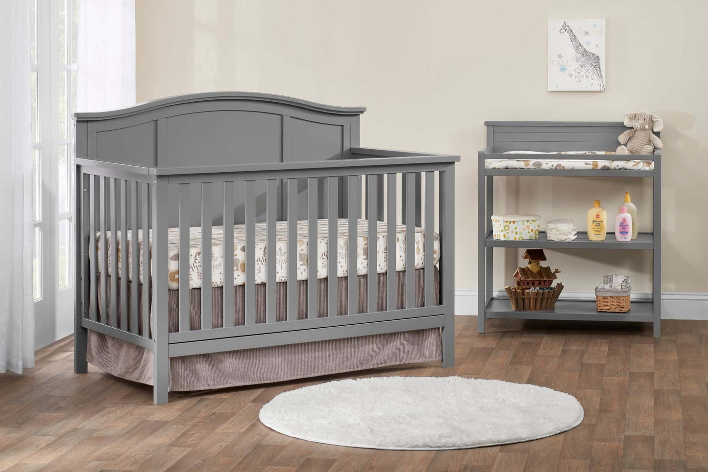 Emerson Guard Rail - Lifestyle Image Inclined Side View of Emerson Crib with Guard Rail Gray